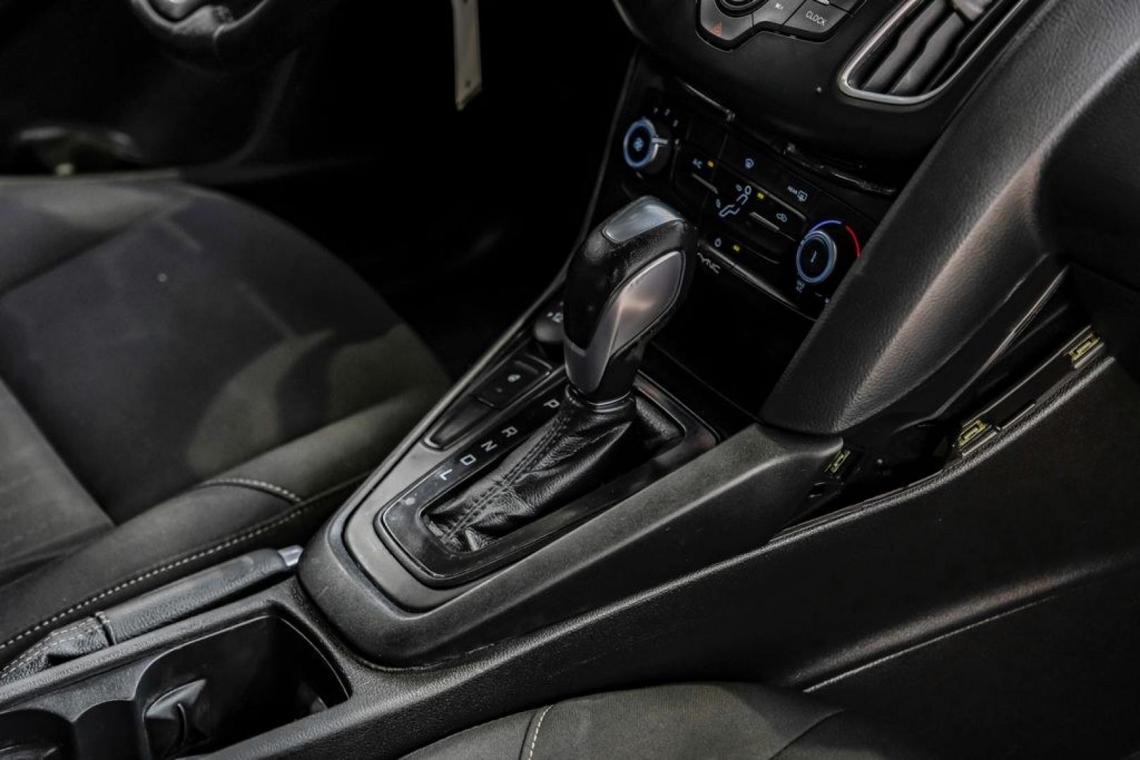 2016 Magnetic /Black Ford Focus SE (1FADP3F22GL) with an 2.0L 4-Cylinder DGI Flex Fuel DOHC engine, Automatic transmission, located at 15300 Midway Rd., Addison, TX, 75001, (972) 702-0011, 32.958321, -96.838074- Photo#29