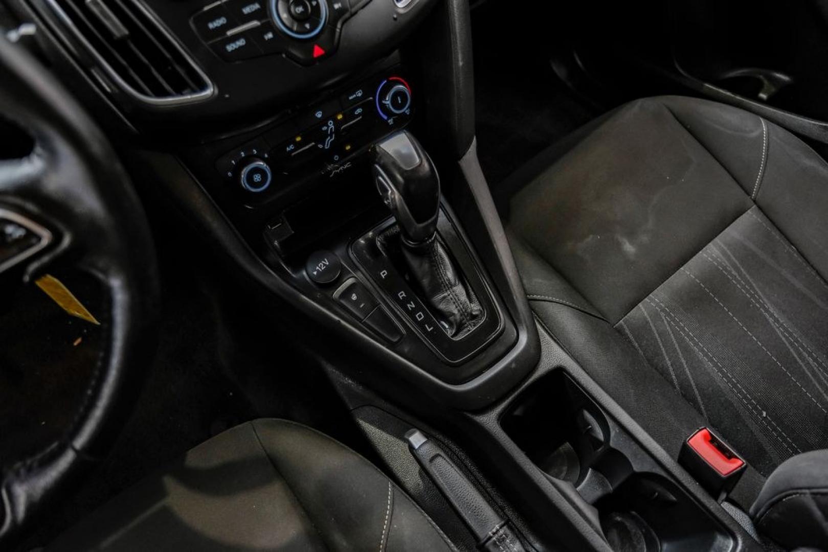 2016 Magnetic /Black Ford Focus SE (1FADP3F22GL) with an 2.0L 4-Cylinder DGI Flex Fuel DOHC engine, Automatic transmission, located at 15300 Midway Rd., Addison, TX, 75001, (972) 702-0011, 32.958321, -96.838074- Photo#30
