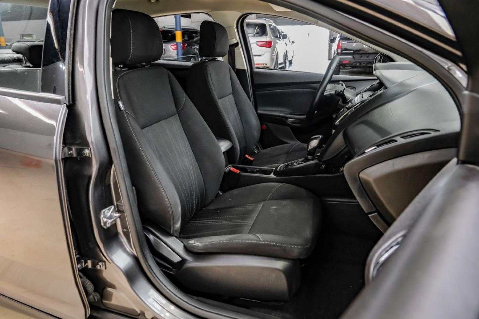2016 Magnetic /Black Ford Focus SE (1FADP3F22GL) with an 2.0L 4-Cylinder DGI Flex Fuel DOHC engine, Automatic transmission, located at 15300 Midway Rd., Addison, TX, 75001, (972) 702-0011, 32.958321, -96.838074- Photo#44