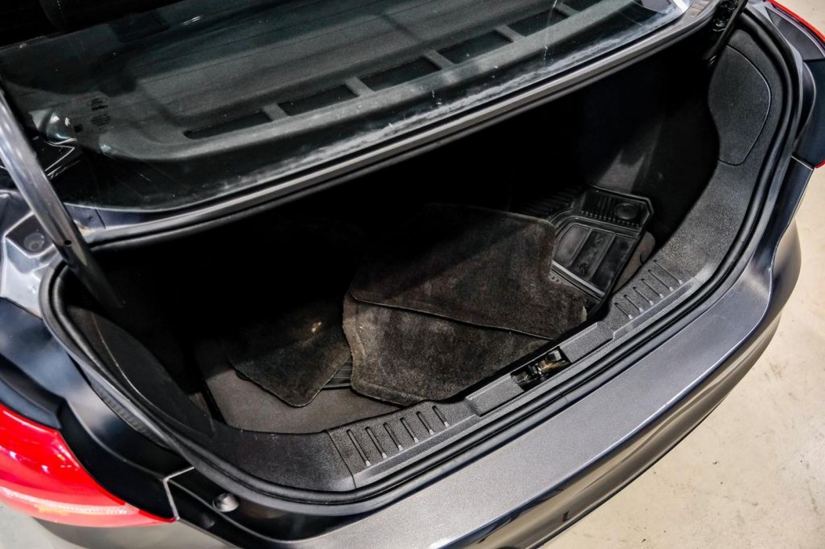 2016 Magnetic /Black Ford Focus SE (1FADP3F22GL) with an 2.0L 4-Cylinder DGI Flex Fuel DOHC engine, Automatic transmission, located at 15300 Midway Rd., Addison, TX, 75001, (972) 702-0011, 32.958321, -96.838074- Photo#64