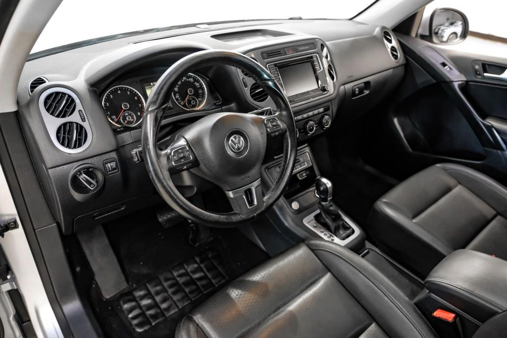 2017 Reflex Silver Metallic /Charcoal Black Volkswagen Tiguan 2.0T Wolfsburg Edition (WVGSV7AX8HK) with an 2.0L TSI DOHC engine, Automatic transmission, located at 15300 Midway Rd., Addison, TX, 75001, (972) 702-0011, 32.958321, -96.838074- Photo#2