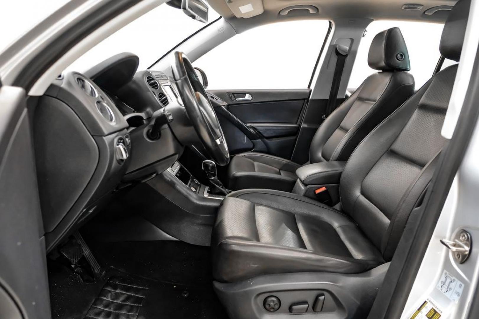 2017 Reflex Silver Metallic /Charcoal Black Volkswagen Tiguan 2.0T Wolfsburg Edition (WVGSV7AX8HK) with an 2.0L TSI DOHC engine, Automatic transmission, located at 15300 Midway Rd., Addison, TX, 75001, (972) 702-0011, 32.958321, -96.838074- Photo#3