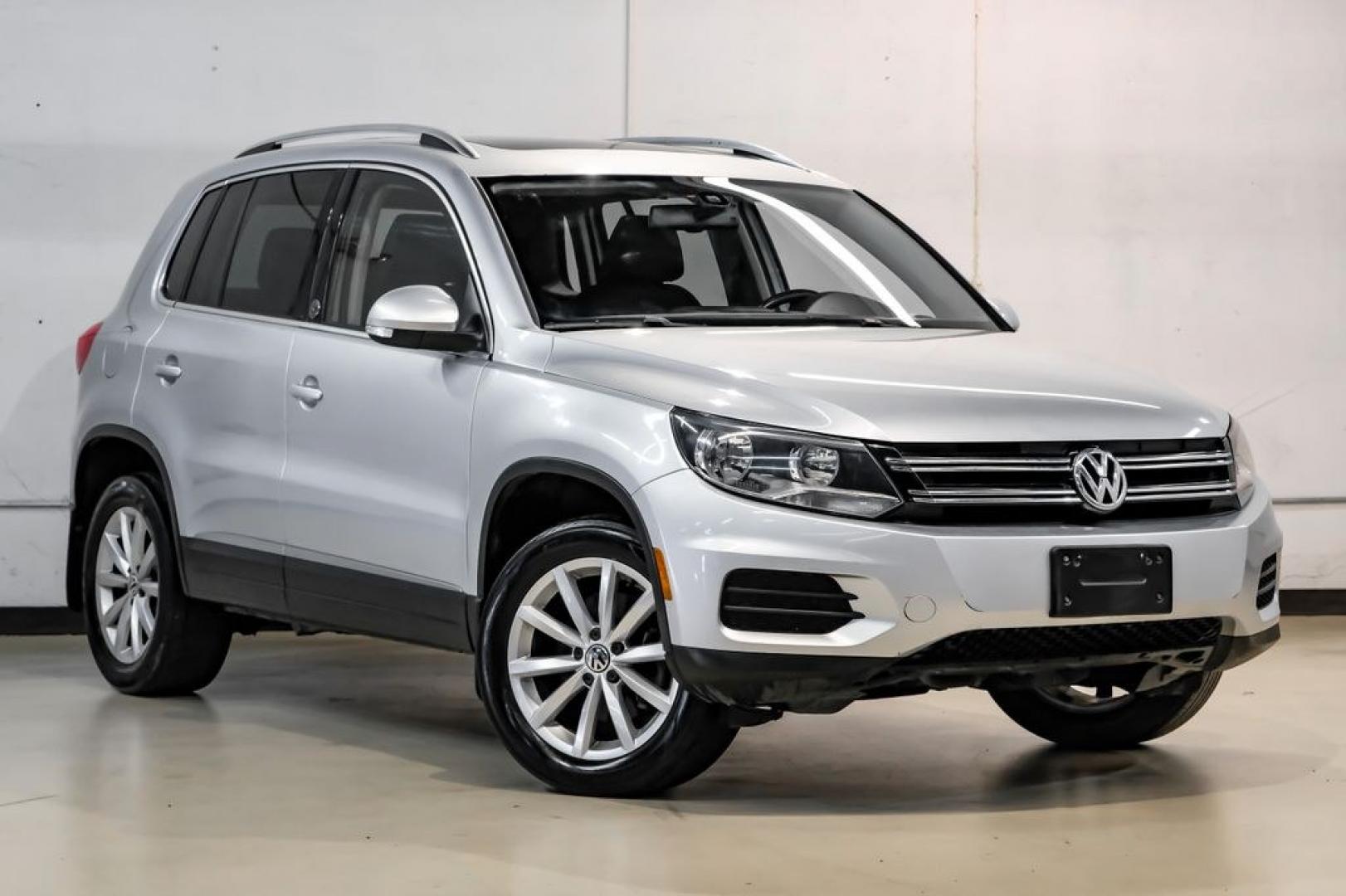 2017 Reflex Silver Metallic /Charcoal Black Volkswagen Tiguan 2.0T Wolfsburg Edition (WVGSV7AX8HK) with an 2.0L TSI DOHC engine, Automatic transmission, located at 15300 Midway Rd., Addison, TX, 75001, (972) 702-0011, 32.958321, -96.838074- Photo#6