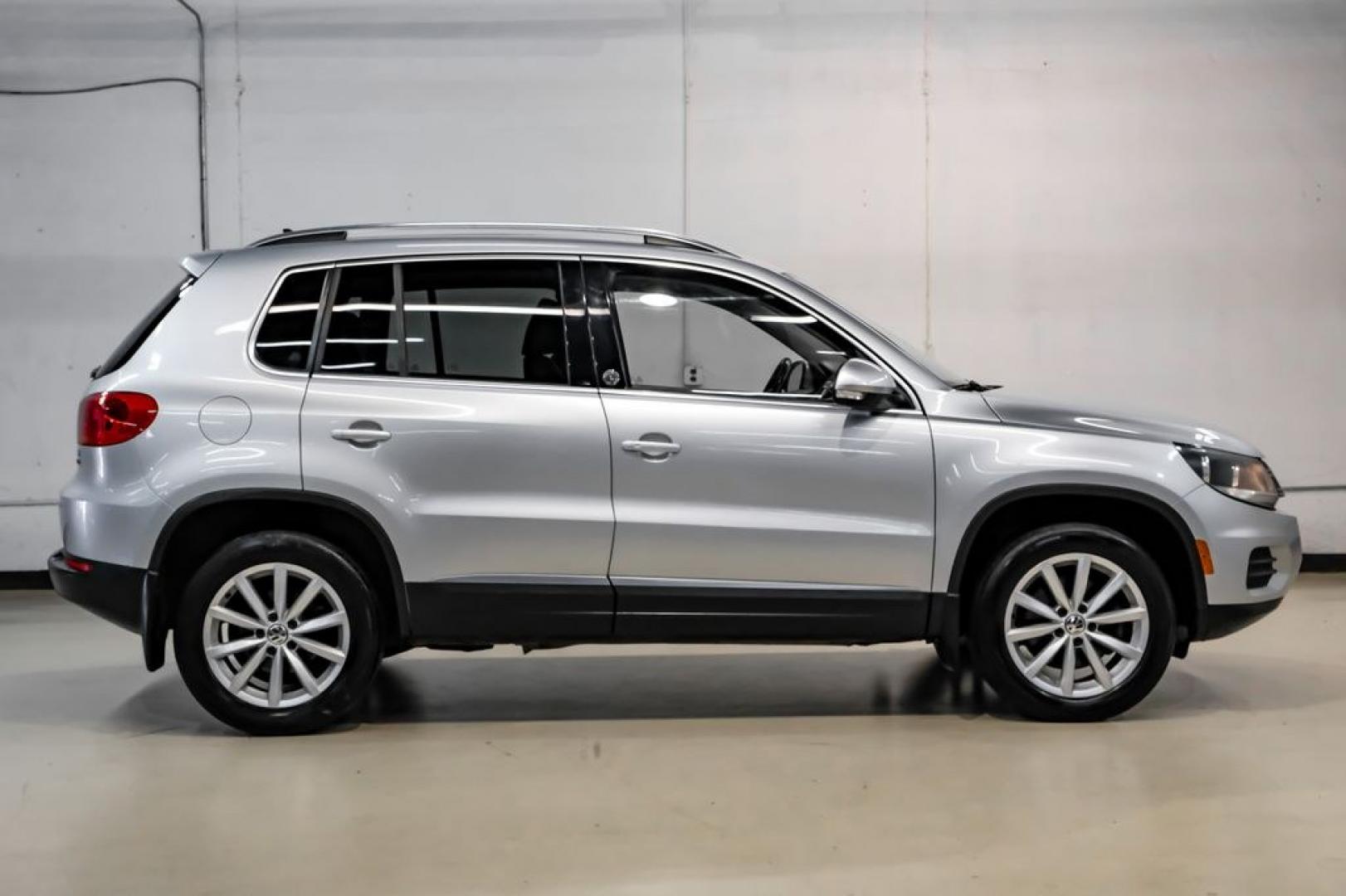 2017 Reflex Silver Metallic /Charcoal Black Volkswagen Tiguan 2.0T Wolfsburg Edition (WVGSV7AX8HK) with an 2.0L TSI DOHC engine, Automatic transmission, located at 15300 Midway Rd., Addison, TX, 75001, (972) 702-0011, 32.958321, -96.838074- Photo#7