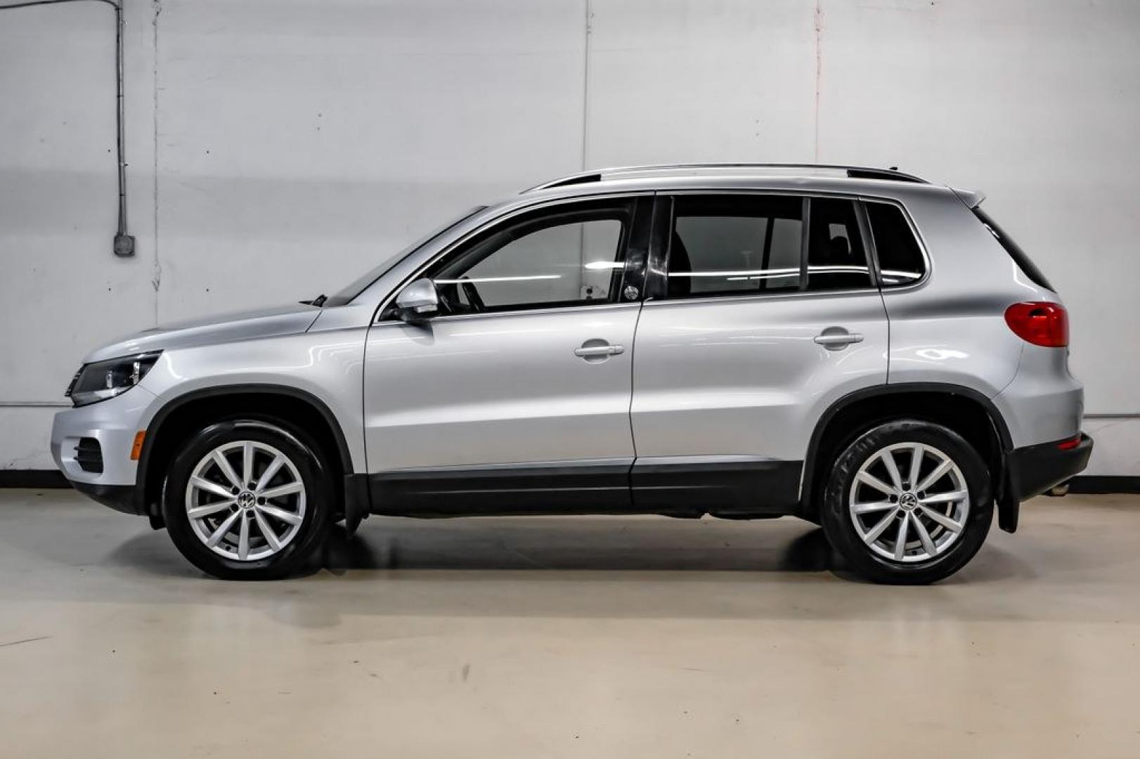 2017 Reflex Silver Metallic /Charcoal Black Volkswagen Tiguan 2.0T Wolfsburg Edition (WVGSV7AX8HK) with an 2.0L TSI DOHC engine, Automatic transmission, located at 15300 Midway Rd., Addison, TX, 75001, (972) 702-0011, 32.958321, -96.838074- Photo#10