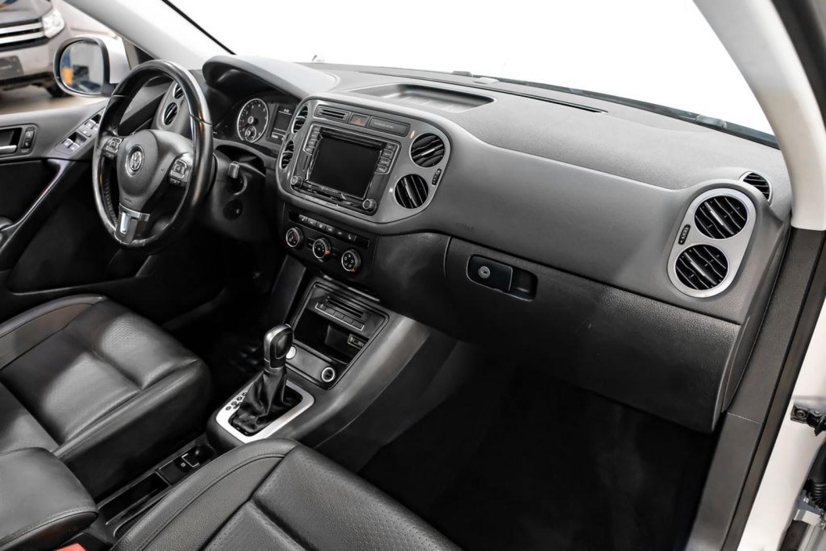 2017 Reflex Silver Metallic /Charcoal Black Volkswagen Tiguan 2.0T Wolfsburg Edition (WVGSV7AX8HK) with an 2.0L TSI DOHC engine, Automatic transmission, located at 15300 Midway Rd., Addison, TX, 75001, (972) 702-0011, 32.958321, -96.838074- Photo#11