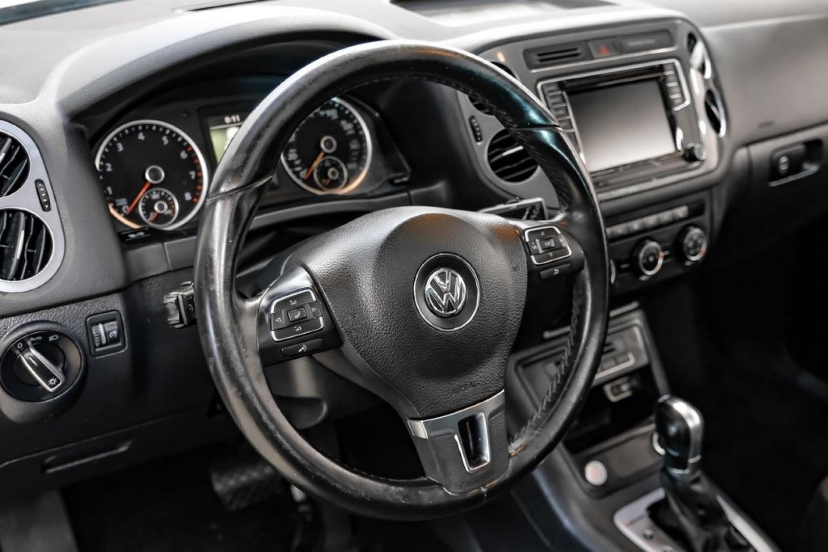 2017 Reflex Silver Metallic /Charcoal Black Volkswagen Tiguan 2.0T Wolfsburg Edition (WVGSV7AX8HK) with an 2.0L TSI DOHC engine, Automatic transmission, located at 15300 Midway Rd., Addison, TX, 75001, (972) 702-0011, 32.958321, -96.838074- Photo#14