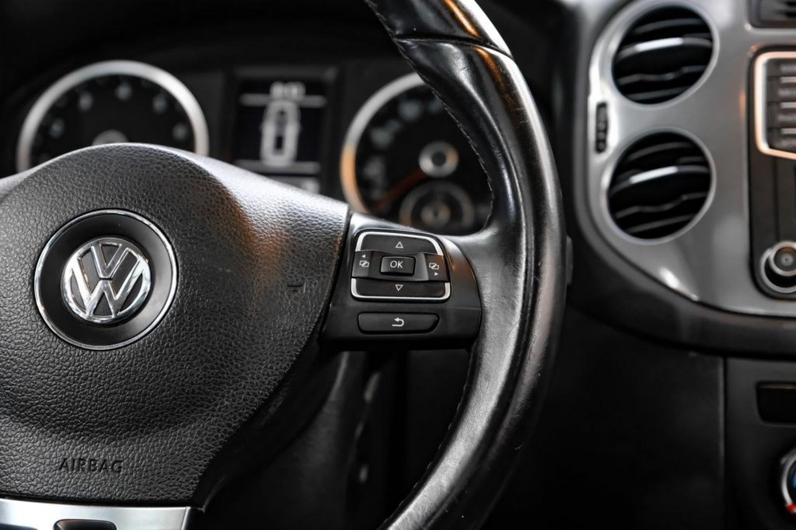 2017 Reflex Silver Metallic /Charcoal Black Volkswagen Tiguan 2.0T Wolfsburg Edition (WVGSV7AX8HK) with an 2.0L TSI DOHC engine, Automatic transmission, located at 15300 Midway Rd., Addison, TX, 75001, (972) 702-0011, 32.958321, -96.838074- Photo#17