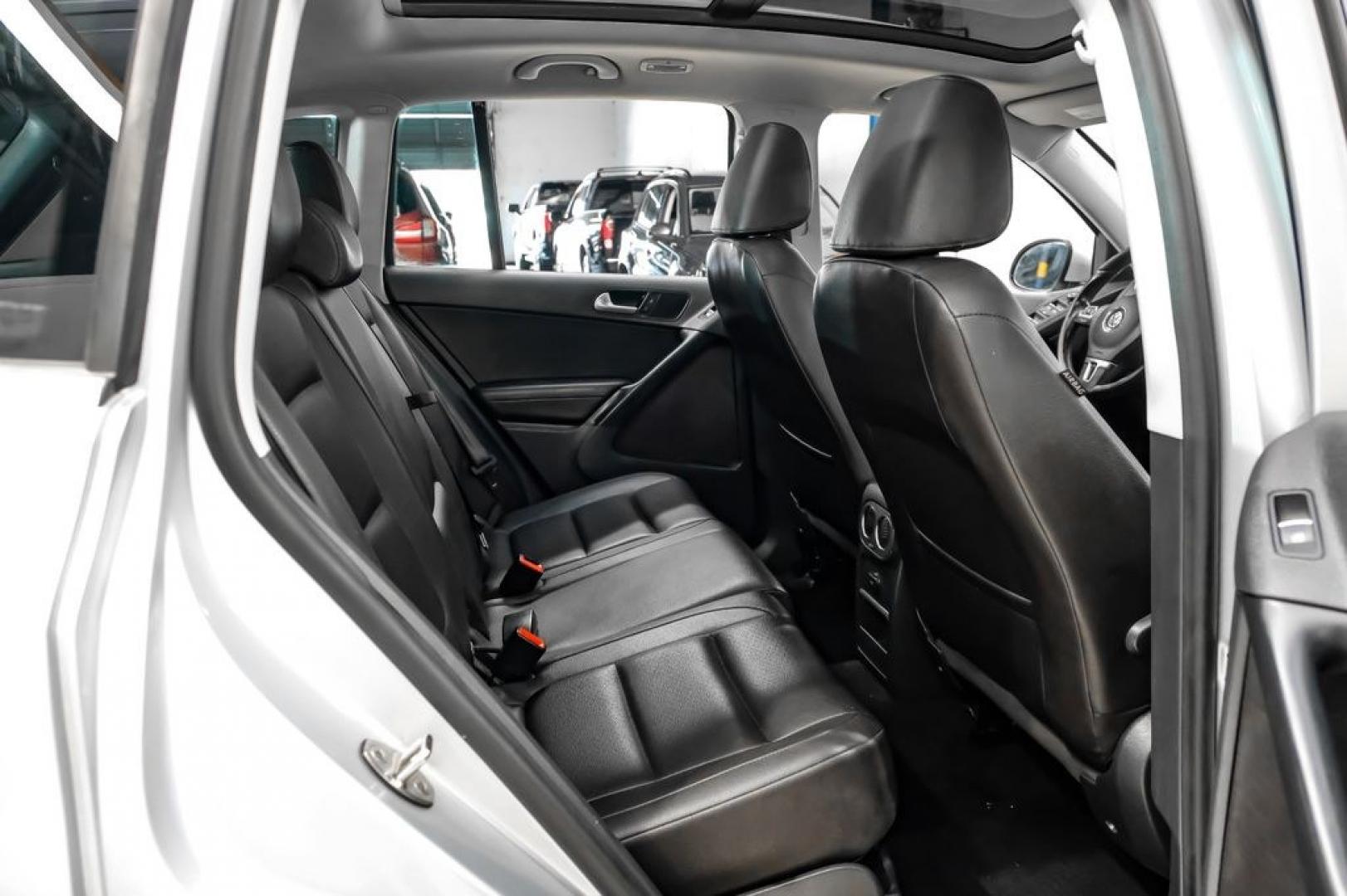 2017 Reflex Silver Metallic /Charcoal Black Volkswagen Tiguan 2.0T Wolfsburg Edition (WVGSV7AX8HK) with an 2.0L TSI DOHC engine, Automatic transmission, located at 15300 Midway Rd., Addison, TX, 75001, (972) 702-0011, 32.958321, -96.838074- Photo#32