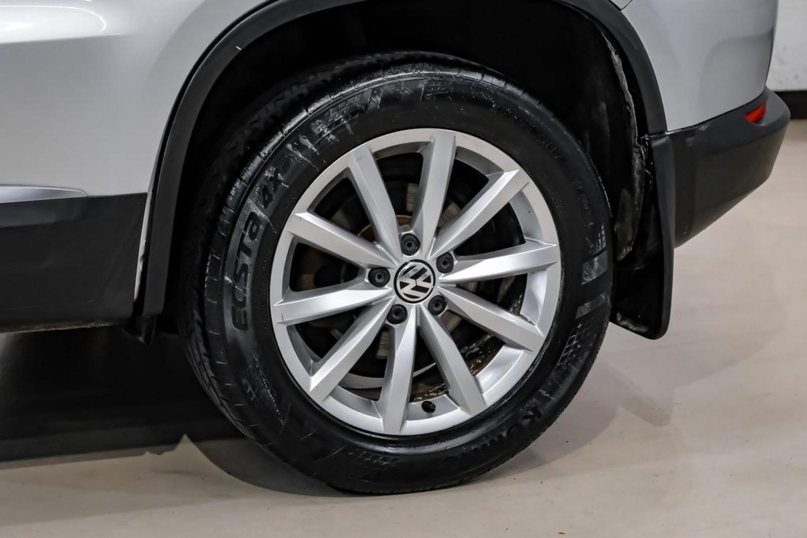 2017 Reflex Silver Metallic /Charcoal Black Volkswagen Tiguan 2.0T Wolfsburg Edition (WVGSV7AX8HK) with an 2.0L TSI DOHC engine, Automatic transmission, located at 15300 Midway Rd., Addison, TX, 75001, (972) 702-0011, 32.958321, -96.838074- Photo#52
