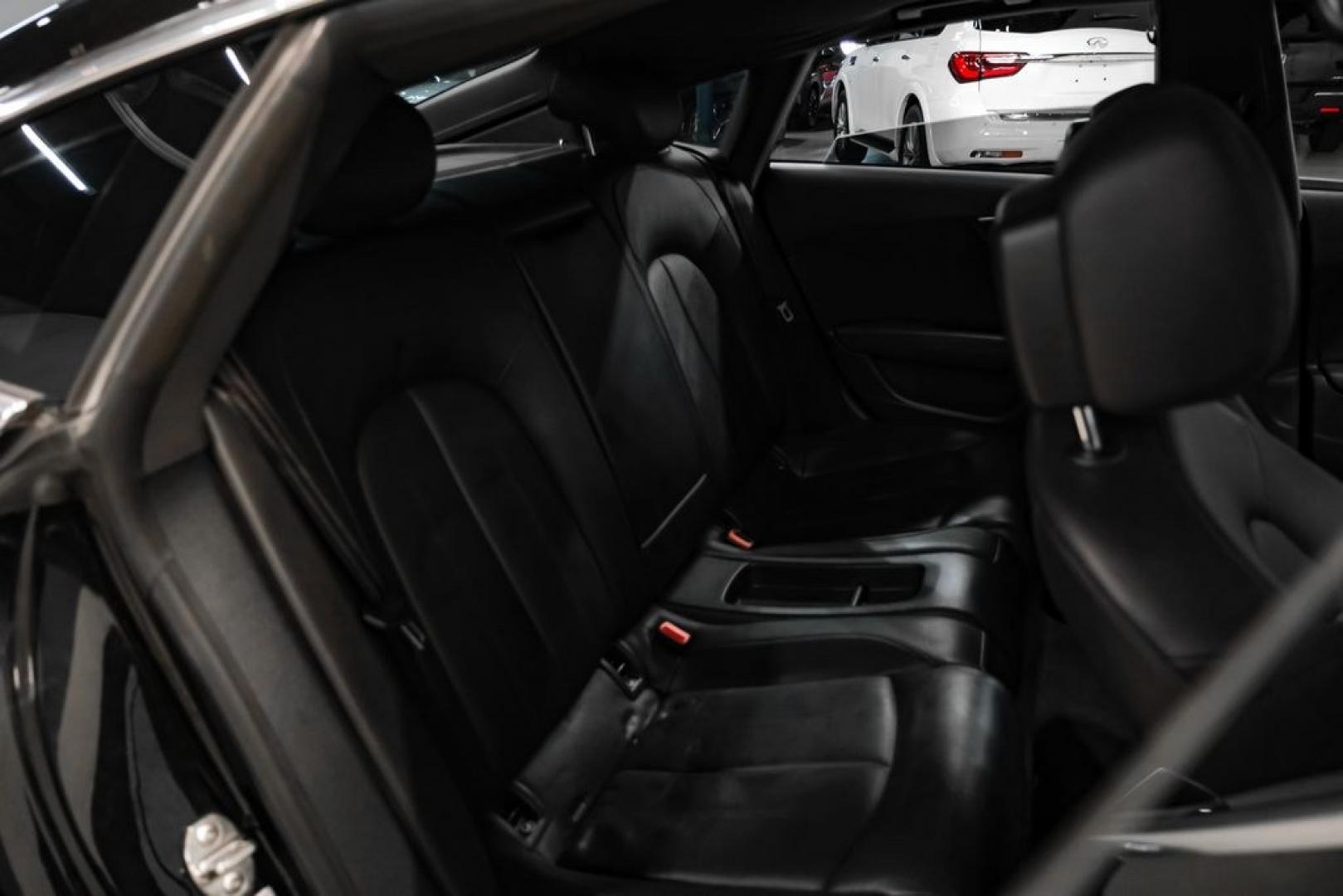 2013 Black Metallic /Black Audi A7 3.0T Premium Plus (WAUYGAFC2DN) with an 3.0L V6 TFSI DOHC Supercharged engine, Automatic transmission, located at 15300 Midway Rd., Addison, TX, 75001, (972) 702-0011, 32.958321, -96.838074 - HOME OF THE NO HAGGLE PRICE - WHOLESALE PRICES TO THE PUBLIC!! A7 3.0T Premium Plus quattro, 4D Hatchback, 3.0L V6 TFSI DOHC Supercharged, 8-Speed Automatic with Tiptronic, quattro, Brilliant Black, Black Leather. Odometer is 2918 miles below market average!Brilliant Black 2013 Audi A7 3.0T Premium- Photo#36