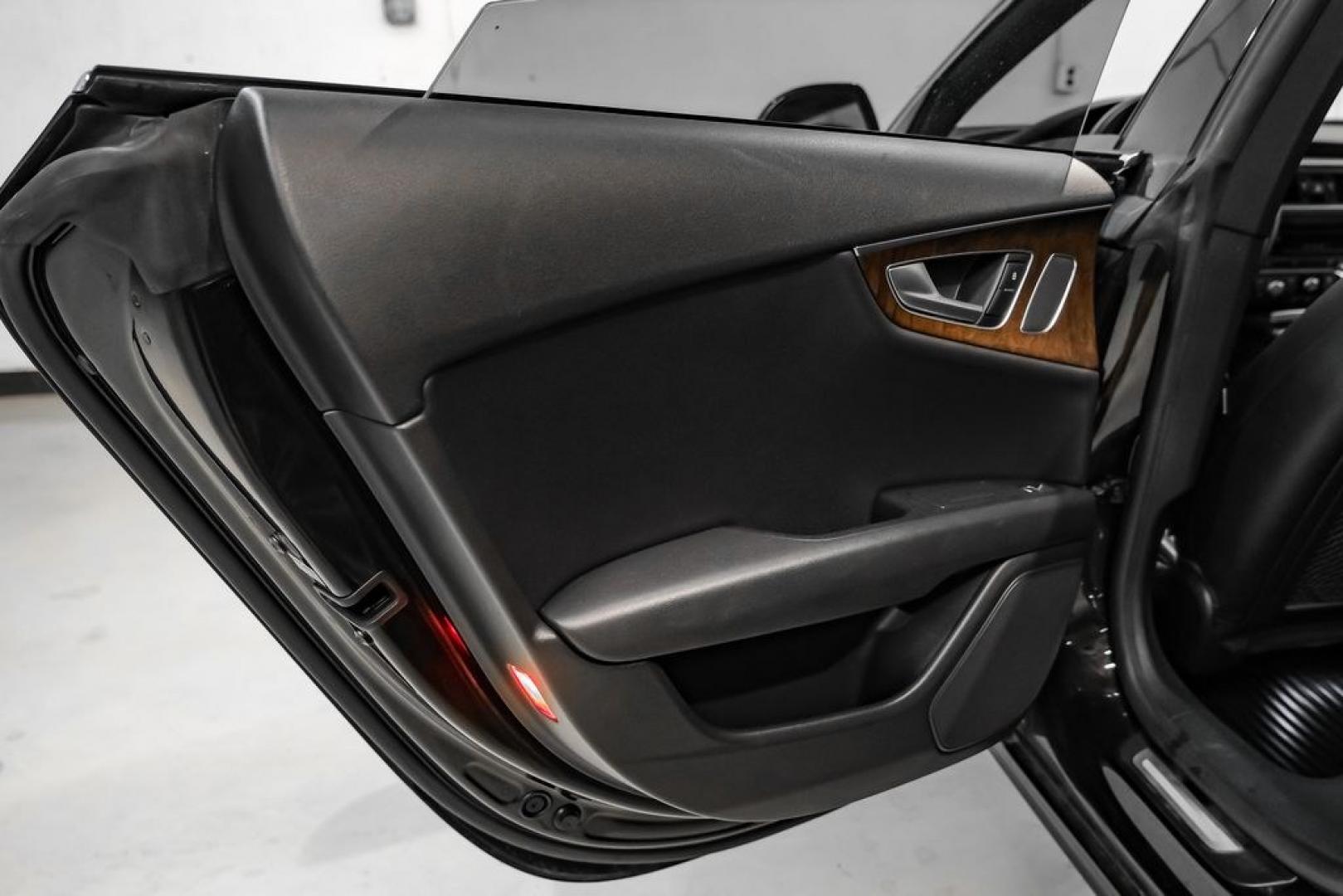 2013 Black Metallic /Black Audi A7 3.0T Premium Plus (WAUYGAFC2DN) with an 3.0L V6 TFSI DOHC Supercharged engine, Automatic transmission, located at 15300 Midway Rd., Addison, TX, 75001, (972) 702-0011, 32.958321, -96.838074 - HOME OF THE NO HAGGLE PRICE - WHOLESALE PRICES TO THE PUBLIC!! A7 3.0T Premium Plus quattro, 4D Hatchback, 3.0L V6 TFSI DOHC Supercharged, 8-Speed Automatic with Tiptronic, quattro, Brilliant Black, Black Leather. Odometer is 2918 miles below market average!Brilliant Black 2013 Audi A7 3.0T Premium- Photo#44