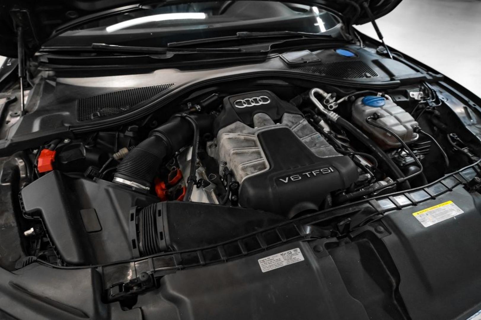 2013 Black Metallic /Black Audi A7 3.0T Premium Plus (WAUYGAFC2DN) with an 3.0L V6 TFSI DOHC Supercharged engine, Automatic transmission, located at 15300 Midway Rd., Addison, TX, 75001, (972) 702-0011, 32.958321, -96.838074 - HOME OF THE NO HAGGLE PRICE - WHOLESALE PRICES TO THE PUBLIC!! A7 3.0T Premium Plus quattro, 4D Hatchback, 3.0L V6 TFSI DOHC Supercharged, 8-Speed Automatic with Tiptronic, quattro, Brilliant Black, Black Leather. Odometer is 2918 miles below market average!Brilliant Black 2013 Audi A7 3.0T Premium- Photo#51