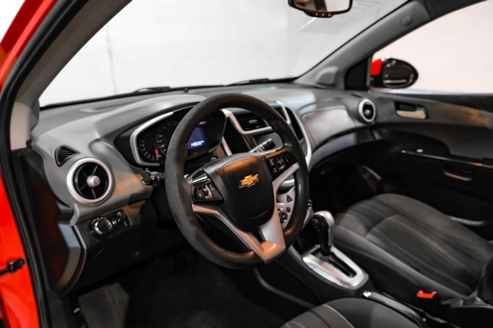 2018 Red /Jet Black/Dark Titanium Chevrolet Sonic LT (1G1JD5SH5J4) with an ECOTEC 1.8L I4 DOHC VVT engine, Automatic transmission, located at 15300 Midway Rd., Addison, TX, 75001, (972) 702-0011, 32.958321, -96.838074- Photo#2