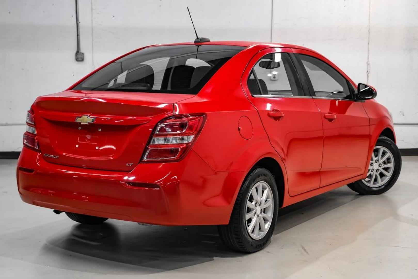 2018 Red /Jet Black/Dark Titanium Chevrolet Sonic LT (1G1JD5SH5J4) with an ECOTEC 1.8L I4 DOHC VVT engine, Automatic transmission, located at 15300 Midway Rd., Addison, TX, 75001, (972) 702-0011, 32.958321, -96.838074- Photo#7