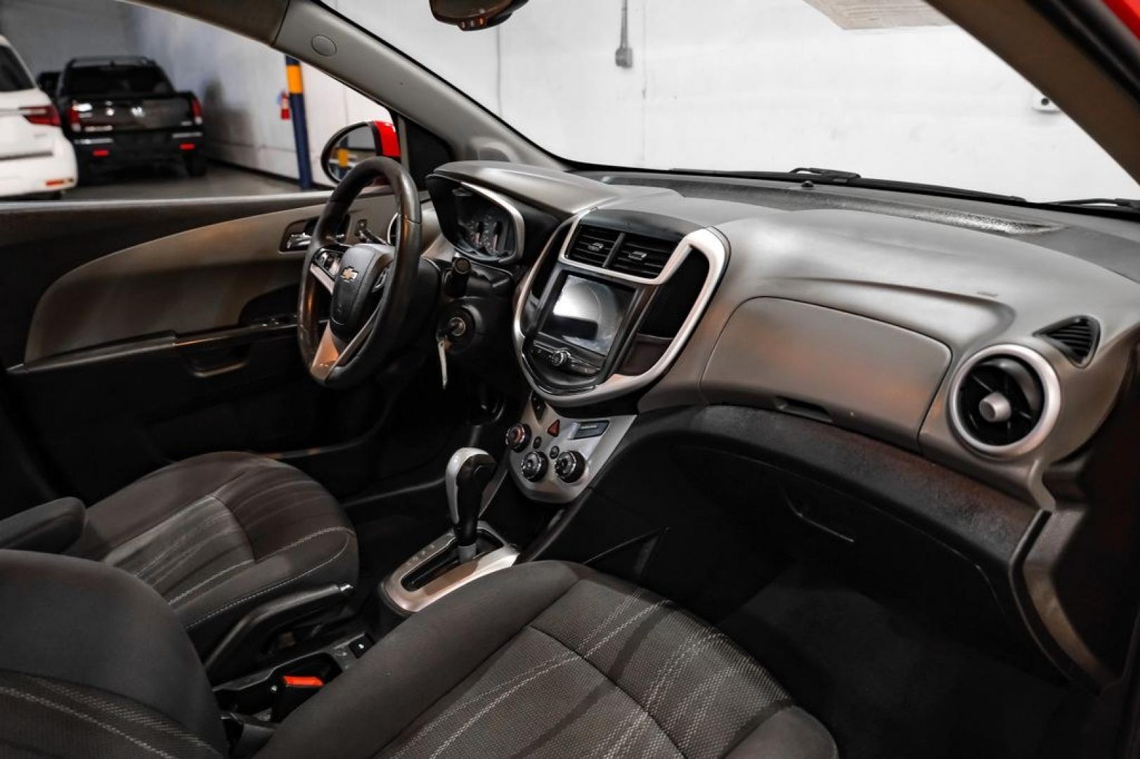 2018 Red /Jet Black/Dark Titanium Chevrolet Sonic LT (1G1JD5SH5J4) with an ECOTEC 1.8L I4 DOHC VVT engine, Automatic transmission, located at 15300 Midway Rd., Addison, TX, 75001, (972) 702-0011, 32.958321, -96.838074- Photo#11
