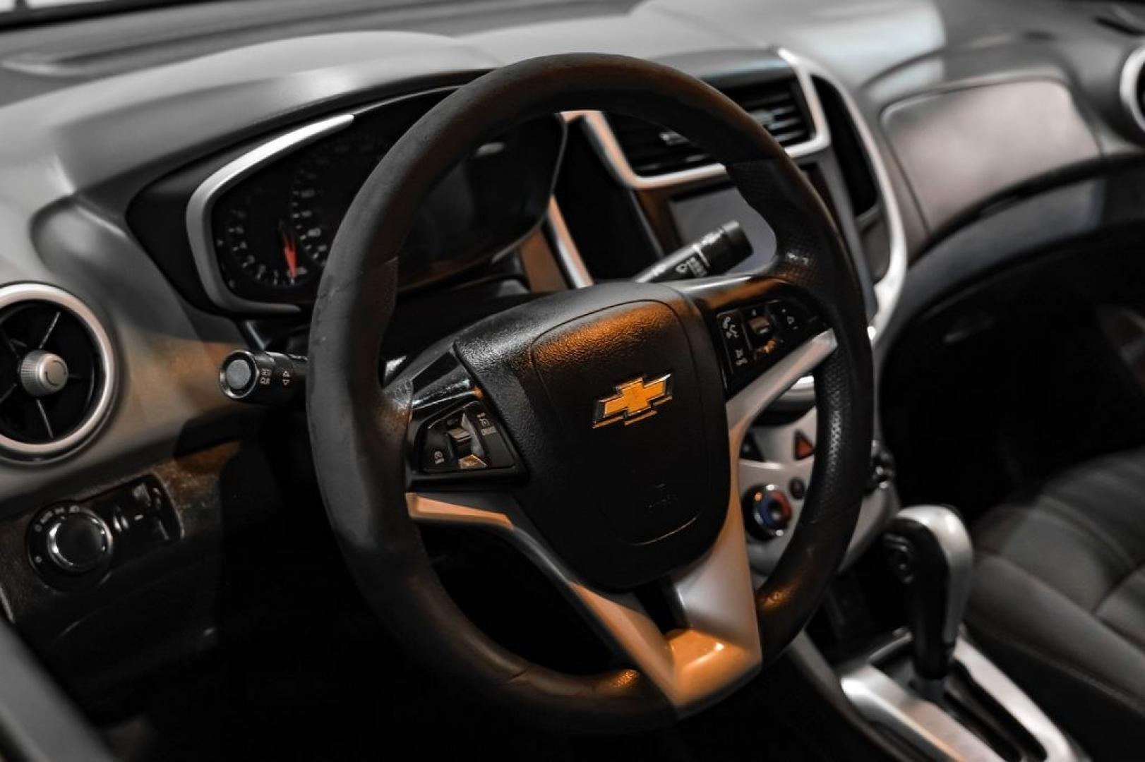 2018 Red /Jet Black/Dark Titanium Chevrolet Sonic LT (1G1JD5SH5J4) with an ECOTEC 1.8L I4 DOHC VVT engine, Automatic transmission, located at 15300 Midway Rd., Addison, TX, 75001, (972) 702-0011, 32.958321, -96.838074- Photo#14