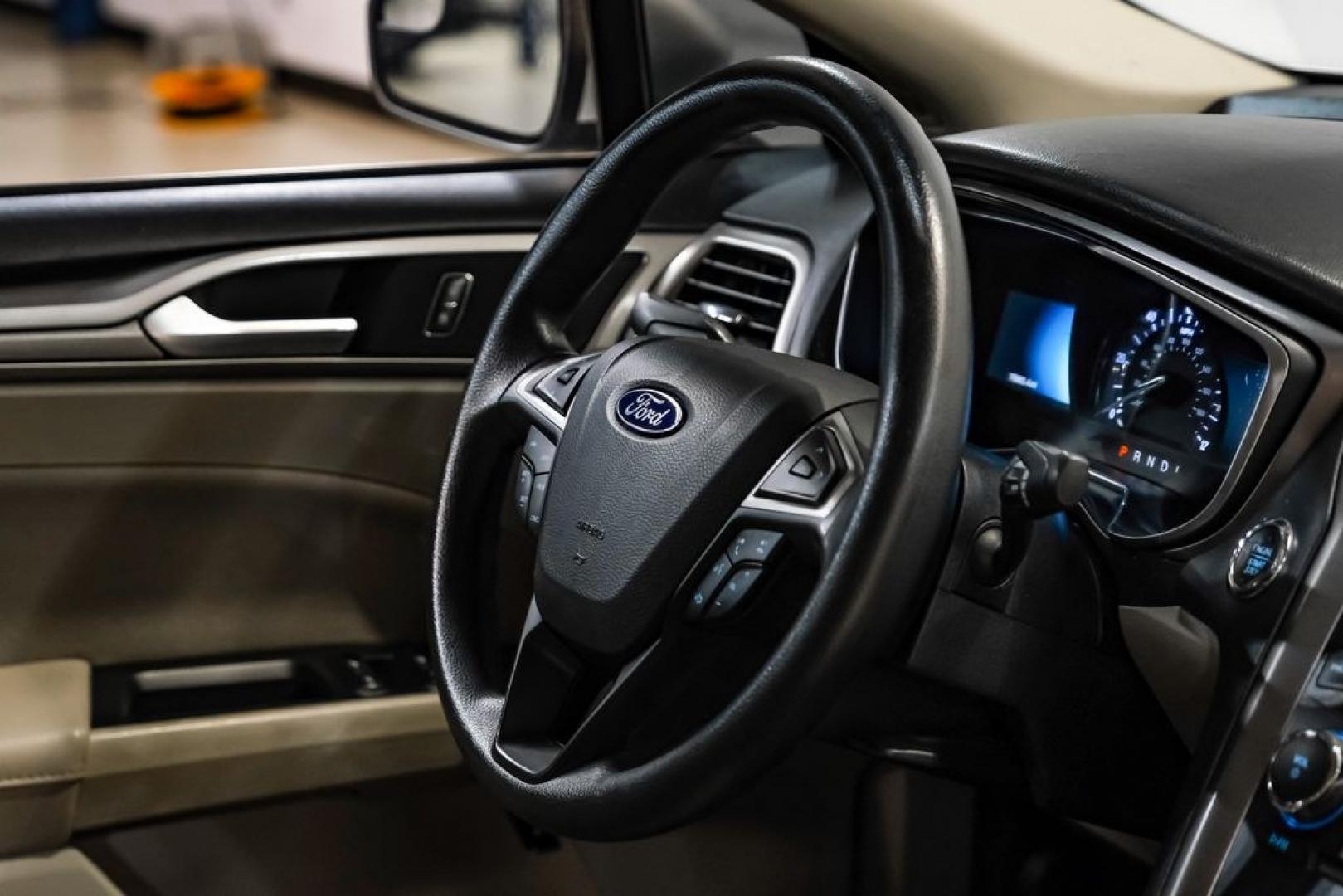 2017 Ingot Silver /Medium Light Stone Ford Fusion Hybrid SE (3FA6P0LU3HR) with an I4 Hybrid engine, CVT transmission, located at 15300 Midway Rd., Addison, TX, 75001, (972) 702-0011, 32.958321, -96.838074- Photo#12
