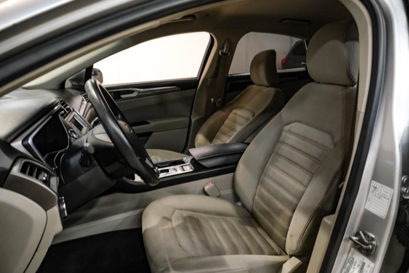 2017 Ingot Silver /Medium Light Stone Ford Fusion Hybrid SE (3FA6P0LU3HR) with an I4 Hybrid engine, CVT transmission, located at 15300 Midway Rd., Addison, TX, 75001, (972) 702-0011, 32.958321, -96.838074- Photo#29