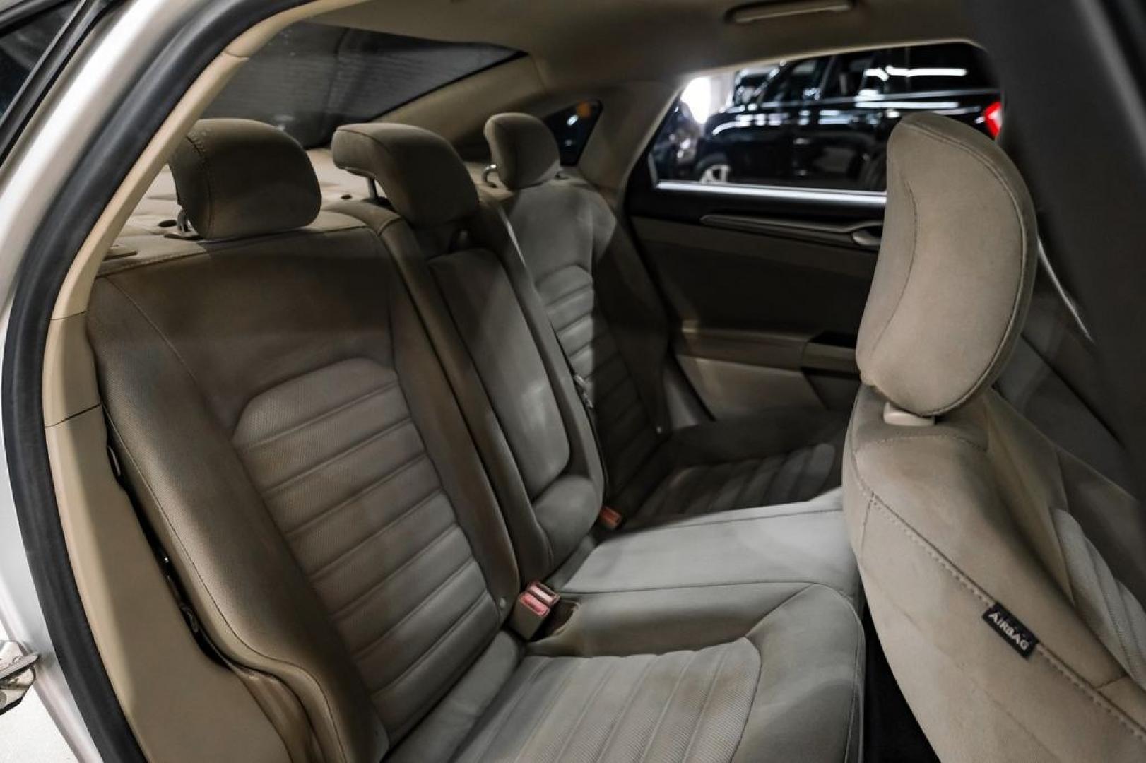 2017 Ingot Silver /Medium Light Stone Ford Fusion Hybrid SE (3FA6P0LU3HR) with an I4 Hybrid engine, CVT transmission, located at 15300 Midway Rd., Addison, TX, 75001, (972) 702-0011, 32.958321, -96.838074- Photo#32