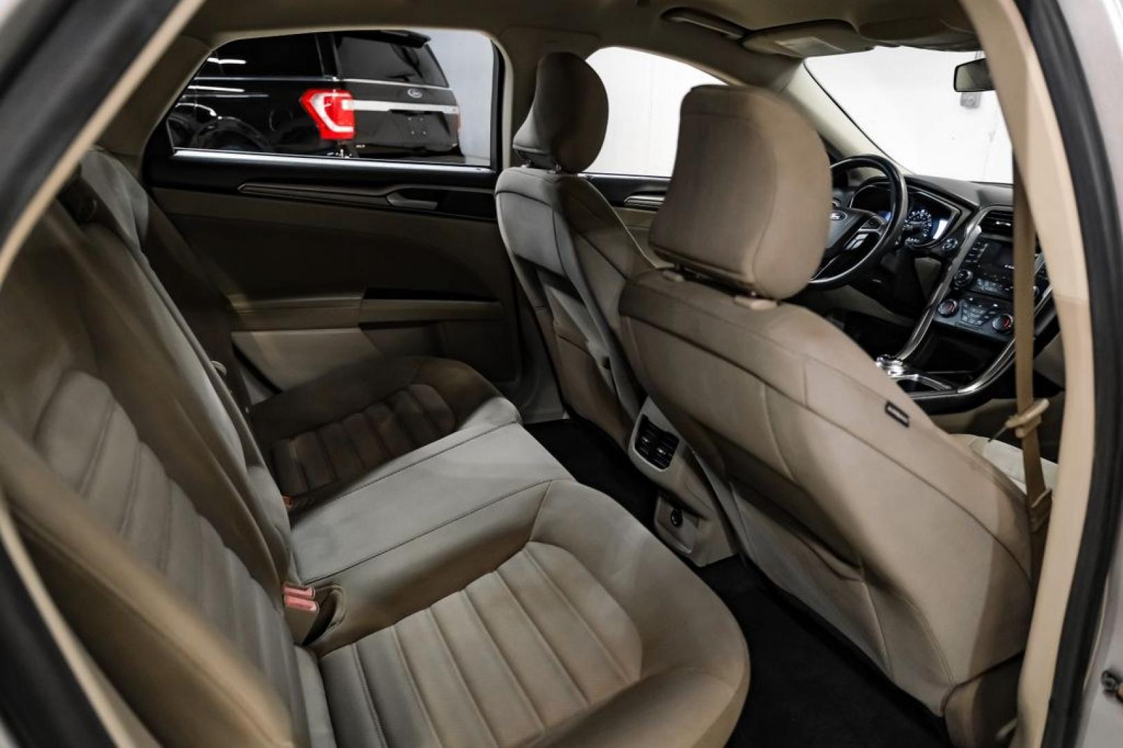 2017 Ingot Silver /Medium Light Stone Ford Fusion Hybrid SE (3FA6P0LU3HR) with an I4 Hybrid engine, CVT transmission, located at 15300 Midway Rd., Addison, TX, 75001, (972) 702-0011, 32.958321, -96.838074- Photo#33