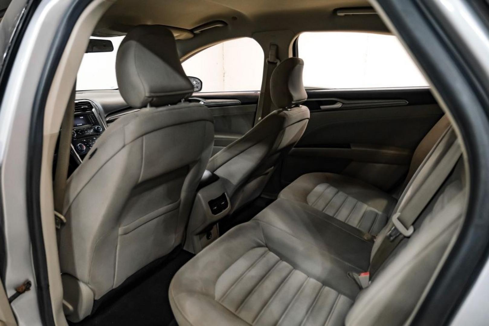 2017 Ingot Silver /Medium Light Stone Ford Fusion Hybrid SE (3FA6P0LU3HR) with an I4 Hybrid engine, CVT transmission, located at 15300 Midway Rd., Addison, TX, 75001, (972) 702-0011, 32.958321, -96.838074- Photo#34