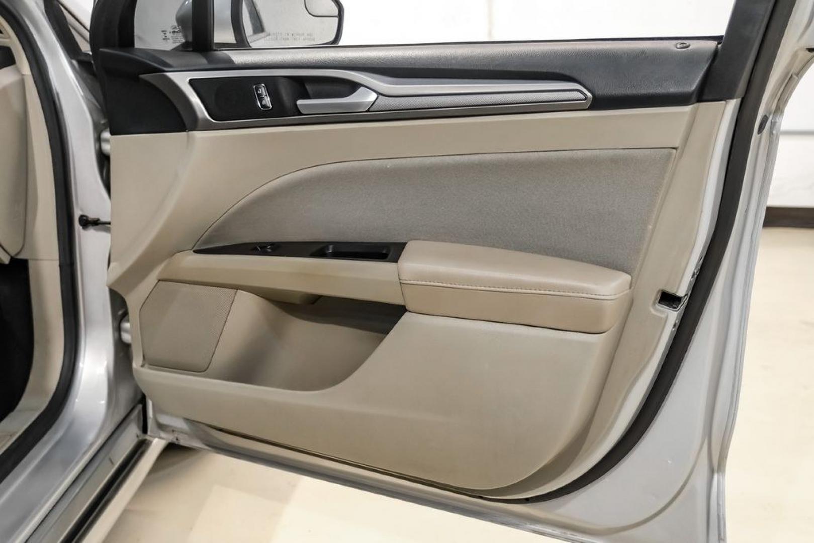 2017 Ingot Silver /Medium Light Stone Ford Fusion Hybrid SE (3FA6P0LU3HR) with an I4 Hybrid engine, CVT transmission, located at 15300 Midway Rd., Addison, TX, 75001, (972) 702-0011, 32.958321, -96.838074- Photo#40
