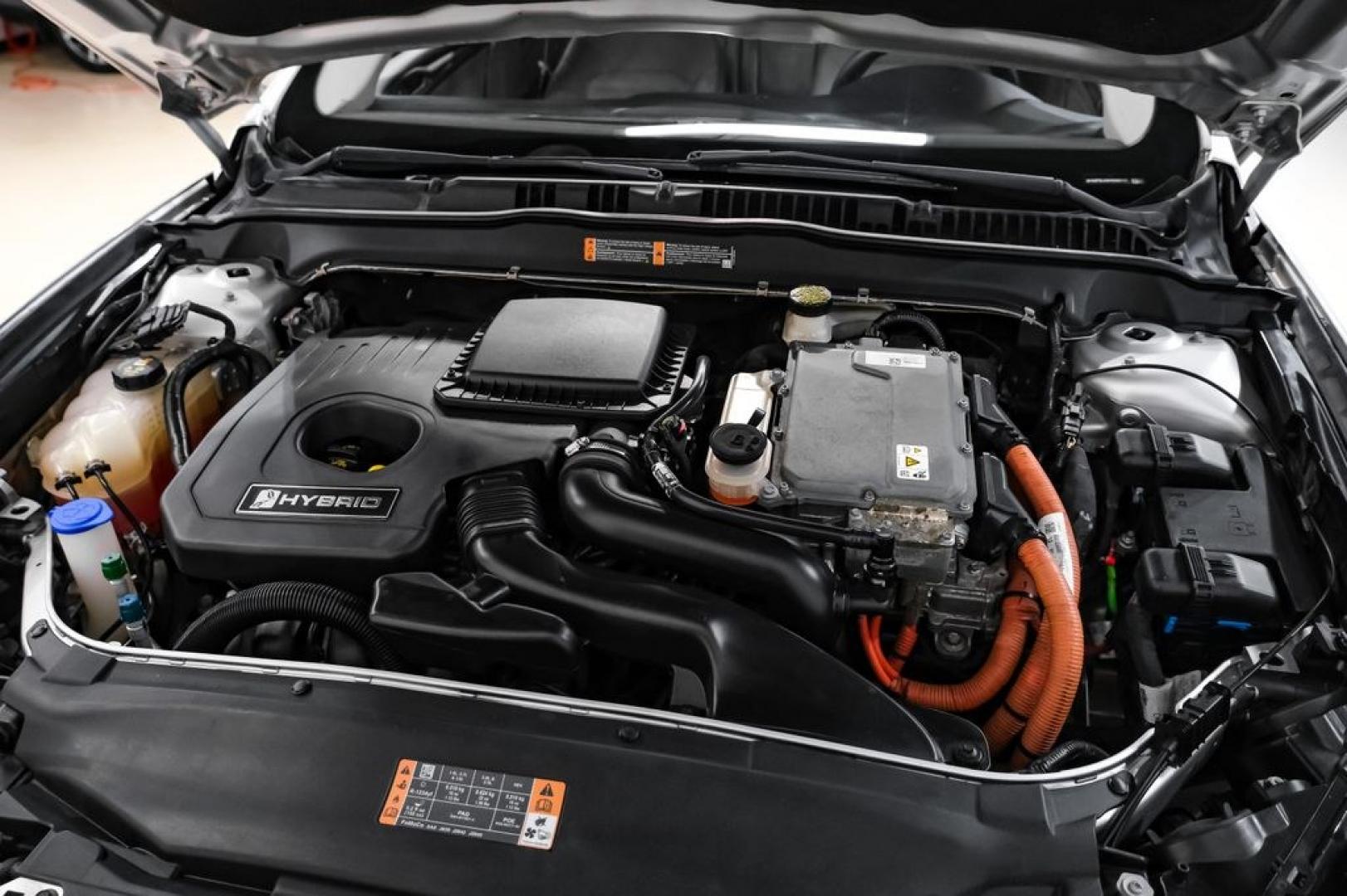 2017 Ingot Silver /Medium Light Stone Ford Fusion Hybrid SE (3FA6P0LU3HR) with an I4 Hybrid engine, CVT transmission, located at 15300 Midway Rd., Addison, TX, 75001, (972) 702-0011, 32.958321, -96.838074- Photo#45