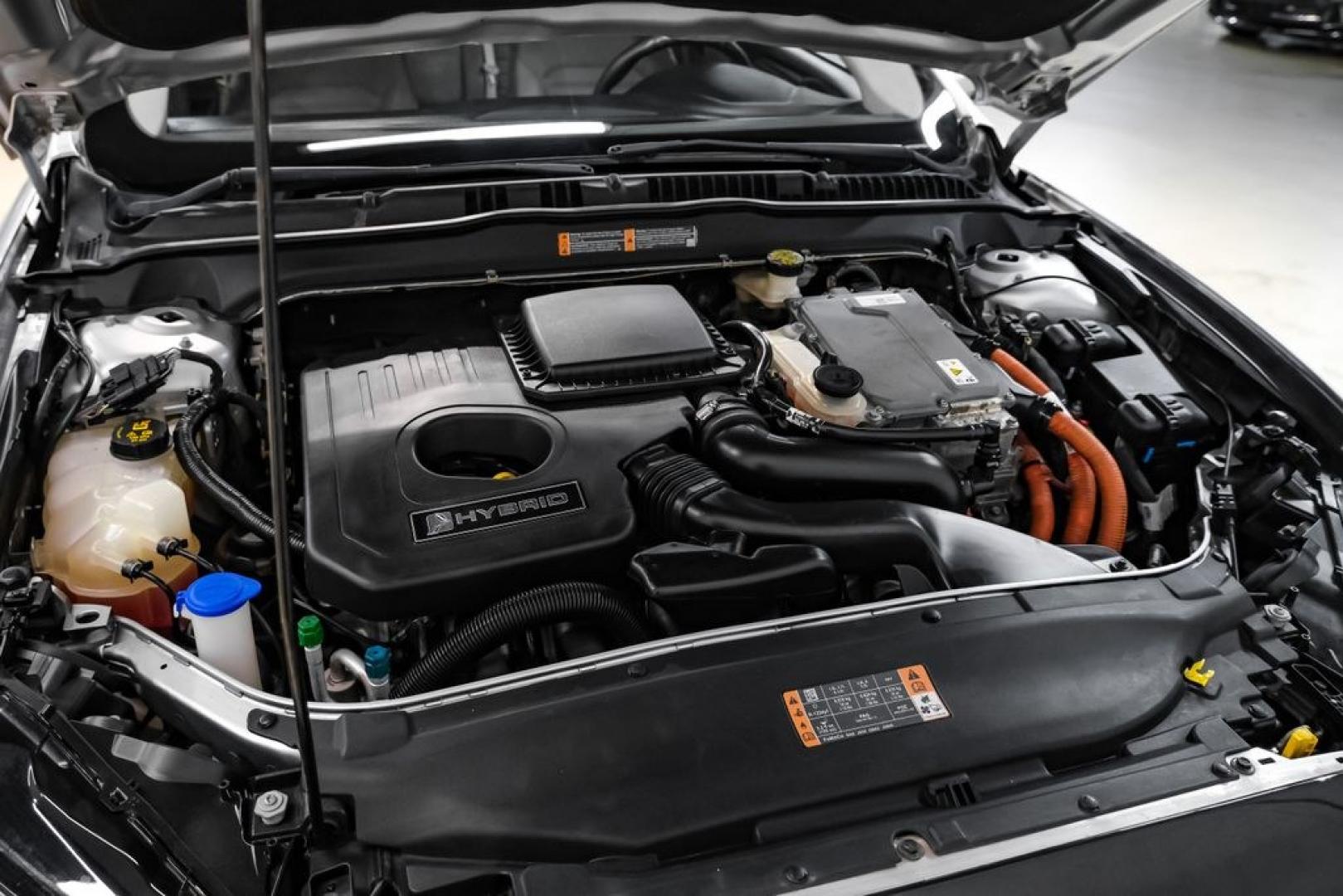 2017 Ingot Silver /Medium Light Stone Ford Fusion Hybrid SE (3FA6P0LU3HR) with an I4 Hybrid engine, CVT transmission, located at 15300 Midway Rd., Addison, TX, 75001, (972) 702-0011, 32.958321, -96.838074- Photo#47