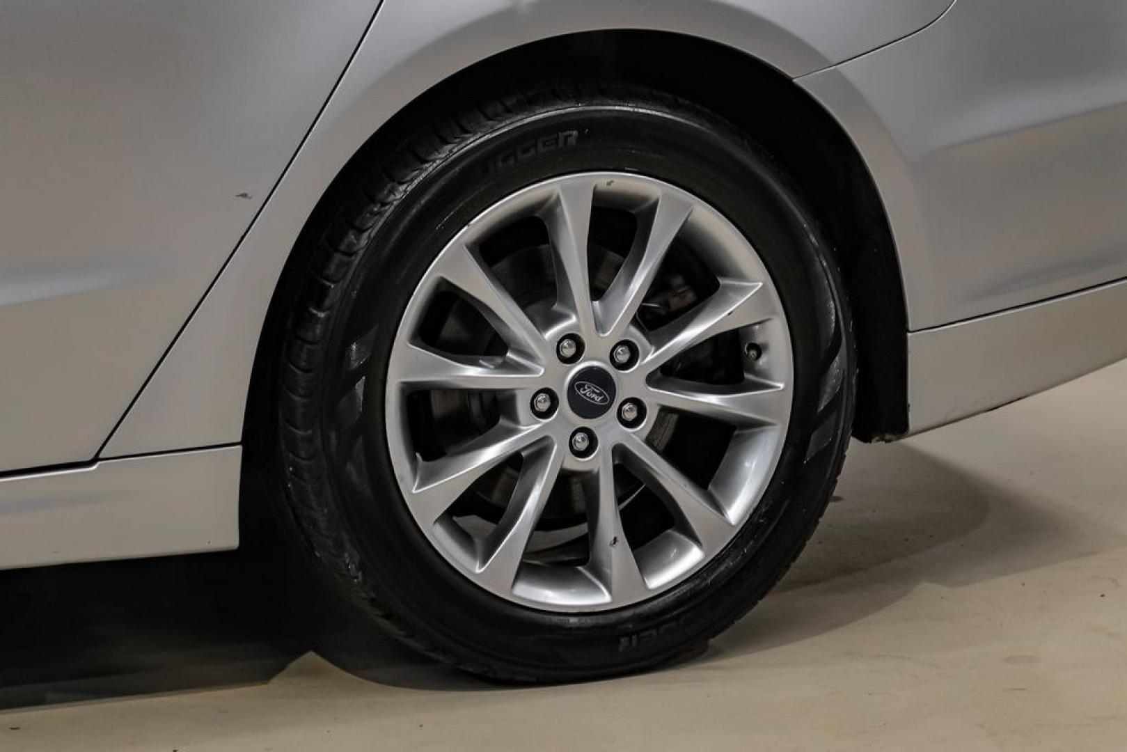2017 Ingot Silver /Medium Light Stone Ford Fusion Hybrid SE (3FA6P0LU3HR) with an I4 Hybrid engine, CVT transmission, located at 15300 Midway Rd., Addison, TX, 75001, (972) 702-0011, 32.958321, -96.838074- Photo#53