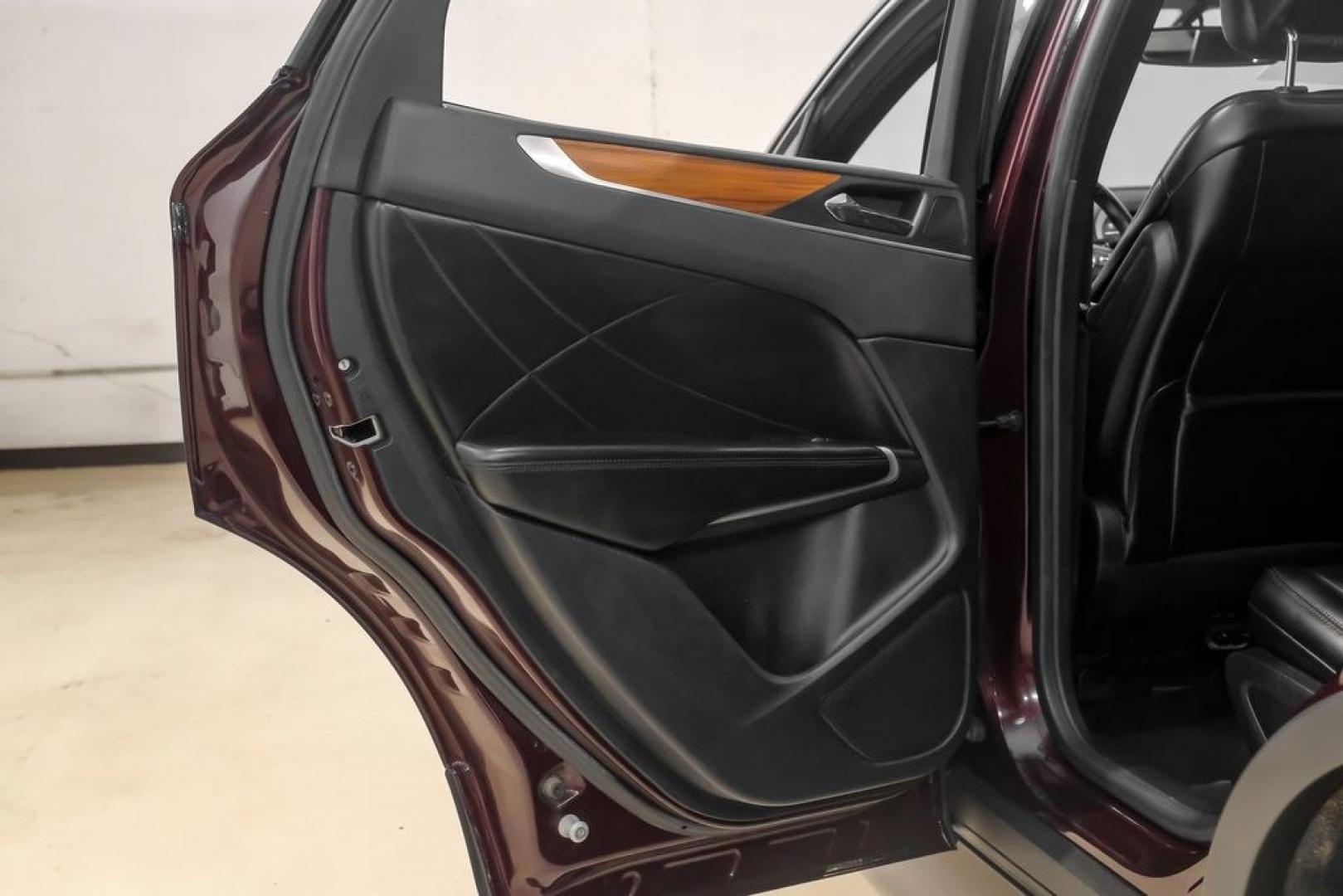 2019 Burgundy /Ebony Lincoln MKC Select (5LMCJ2C97KU) with an 2.0L I4 engine, Automatic transmission, located at 15300 Midway Rd., Addison, TX, 75001, (972) 702-0011, 32.958321, -96.838074- Photo#56