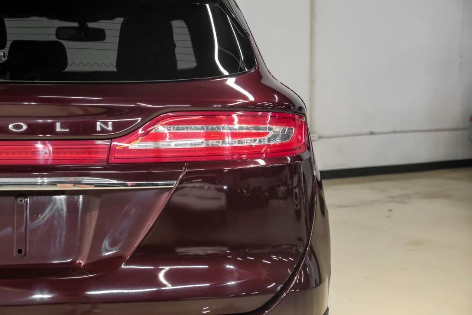 2019 Burgundy /Ebony Lincoln MKC Select (5LMCJ2C97KU) with an 2.0L I4 engine, Automatic transmission, located at 15300 Midway Rd., Addison, TX, 75001, (972) 702-0011, 32.958321, -96.838074- Photo#59