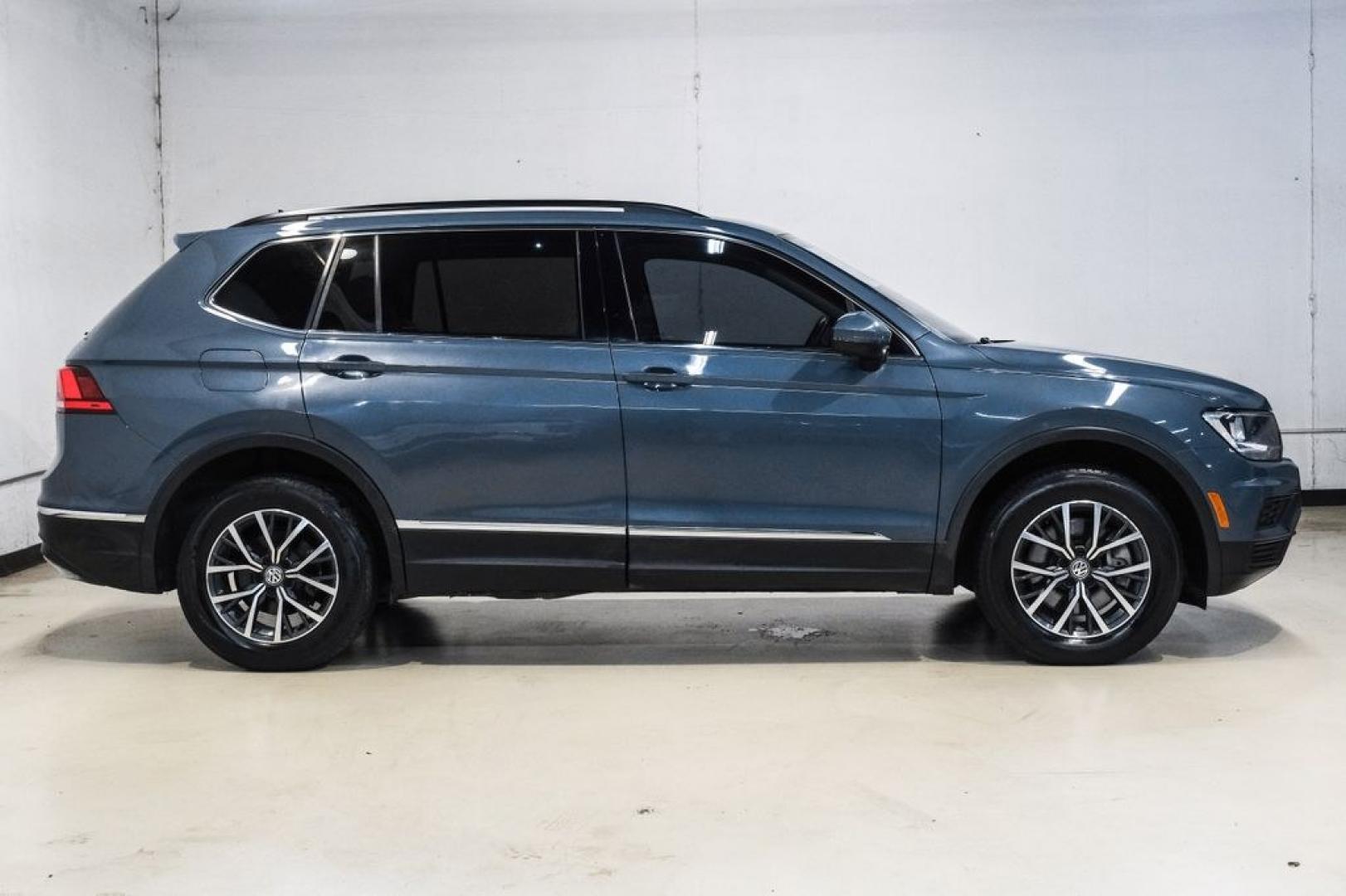 2020 Blue Metallic /Storm Gray Volkswagen Tiguan 2.0T SE (3VV3B7AX0LM) with an 2.0L TSI DOHC engine, Automatic transmission, located at 15300 Midway Rd., Addison, TX, 75001, (972) 702-0011, 32.958321, -96.838074- Photo#9