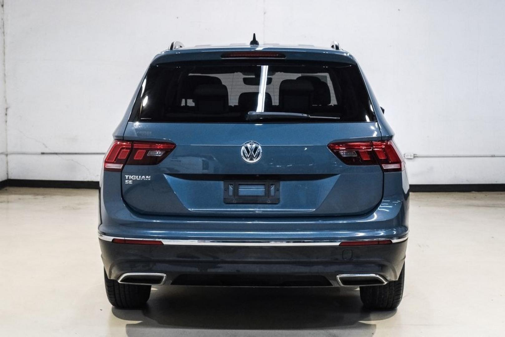 2020 Blue Metallic /Storm Gray Volkswagen Tiguan 2.0T SE (3VV3B7AX0LM) with an 2.0L TSI DOHC engine, Automatic transmission, located at 15300 Midway Rd., Addison, TX, 75001, (972) 702-0011, 32.958321, -96.838074- Photo#11