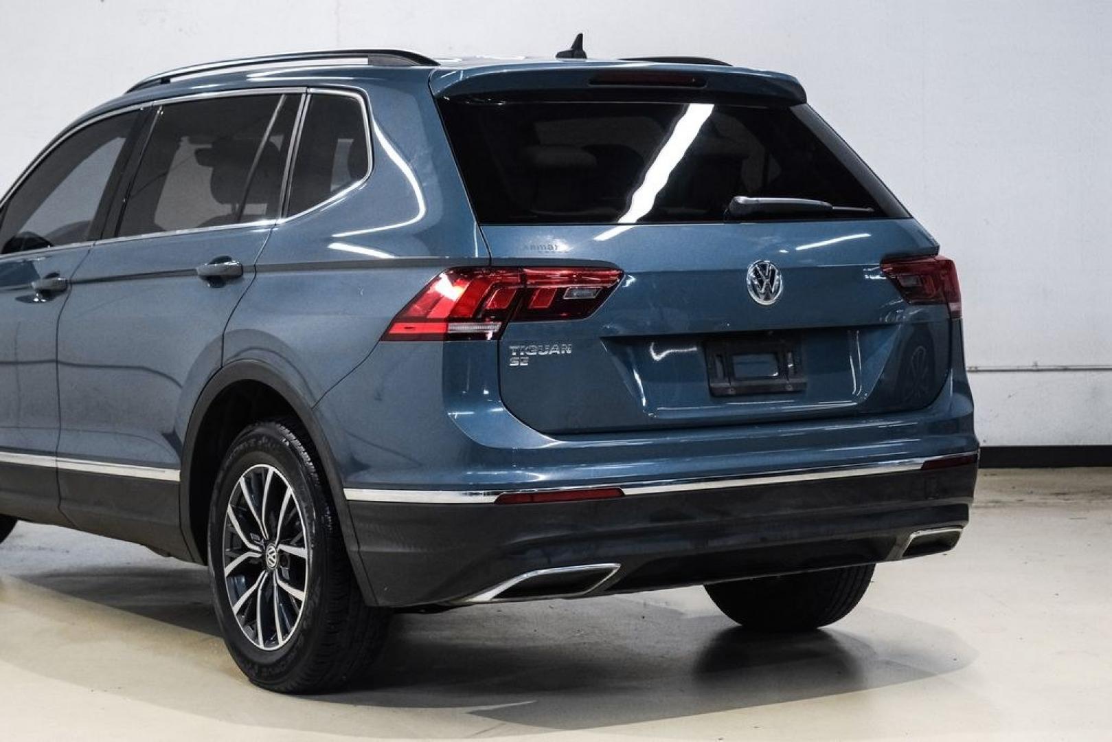 2020 Blue Metallic /Storm Gray Volkswagen Tiguan 2.0T SE (3VV3B7AX0LM) with an 2.0L TSI DOHC engine, Automatic transmission, located at 15300 Midway Rd., Addison, TX, 75001, (972) 702-0011, 32.958321, -96.838074- Photo#14