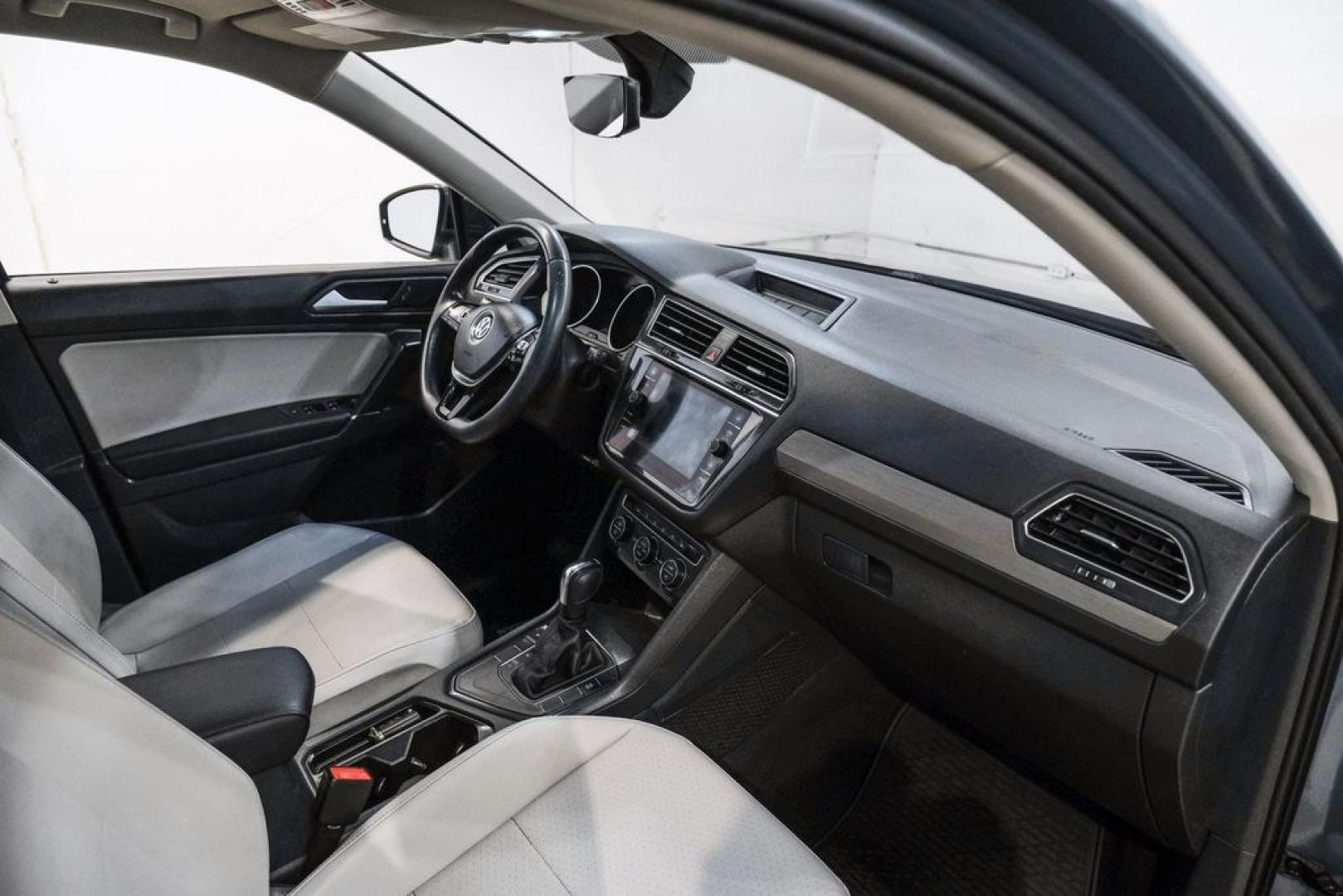 2020 Blue Metallic /Storm Gray Volkswagen Tiguan 2.0T SE (3VV3B7AX0LM) with an 2.0L TSI DOHC engine, Automatic transmission, located at 15300 Midway Rd., Addison, TX, 75001, (972) 702-0011, 32.958321, -96.838074- Photo#18