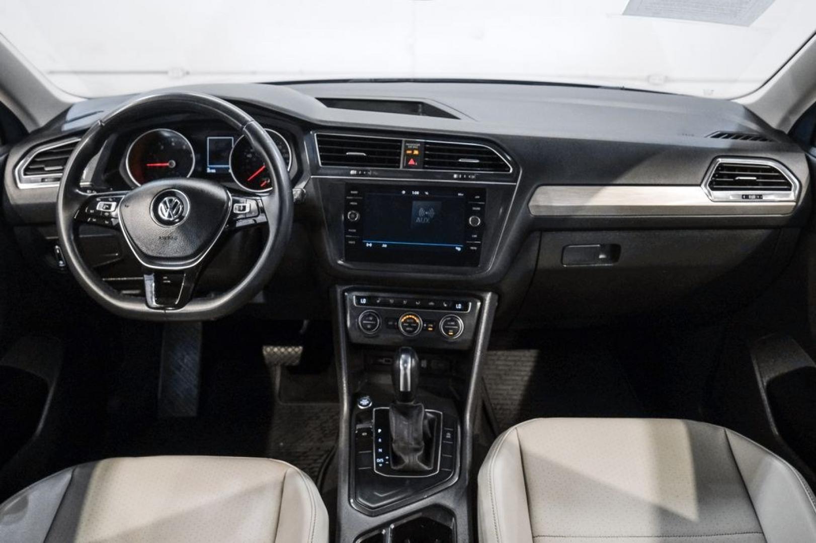 2020 Blue Metallic /Storm Gray Volkswagen Tiguan 2.0T SE (3VV3B7AX0LM) with an 2.0L TSI DOHC engine, Automatic transmission, located at 15300 Midway Rd., Addison, TX, 75001, (972) 702-0011, 32.958321, -96.838074- Photo#19