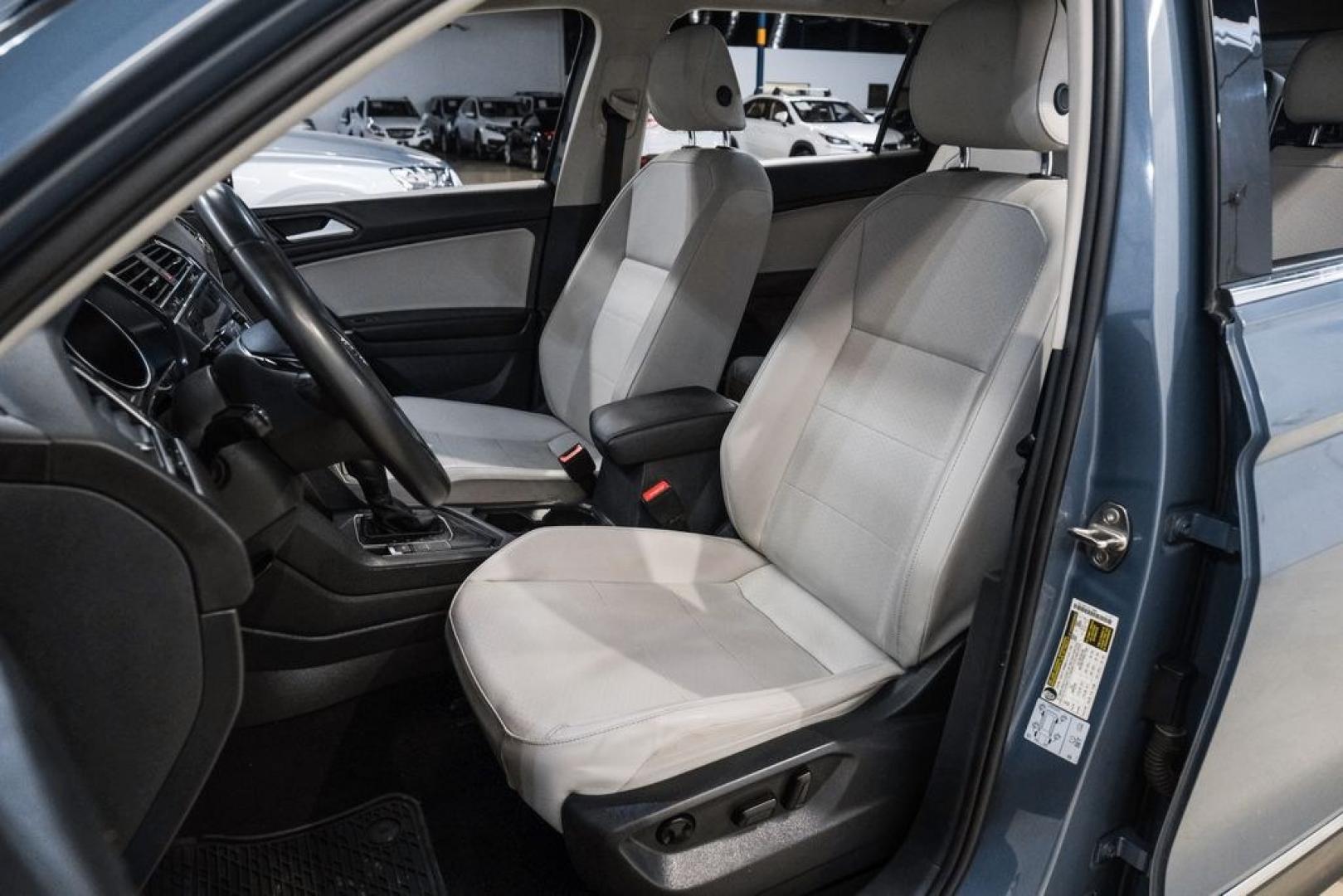 2020 Blue Metallic /Storm Gray Volkswagen Tiguan 2.0T SE (3VV3B7AX0LM) with an 2.0L TSI DOHC engine, Automatic transmission, located at 15300 Midway Rd., Addison, TX, 75001, (972) 702-0011, 32.958321, -96.838074- Photo#29