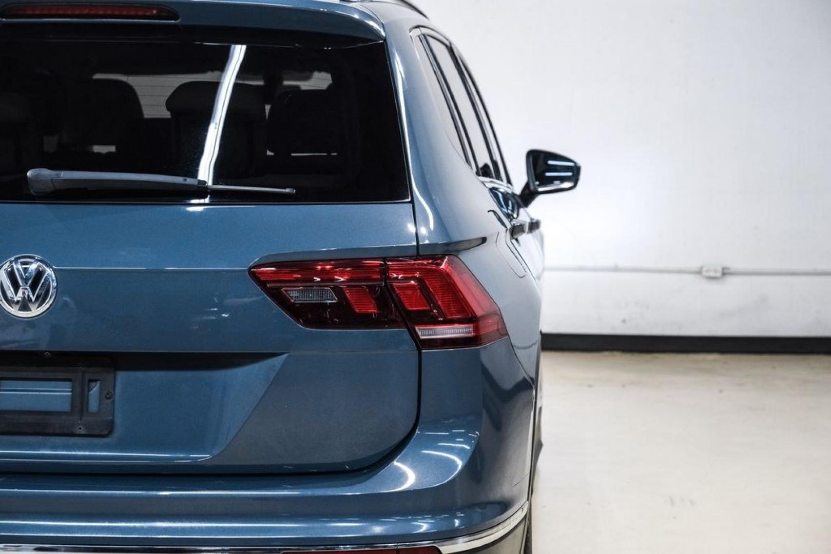 2020 Blue Metallic /Storm Gray Volkswagen Tiguan 2.0T SE (3VV3B7AX0LM) with an 2.0L TSI DOHC engine, Automatic transmission, located at 15300 Midway Rd., Addison, TX, 75001, (972) 702-0011, 32.958321, -96.838074- Photo#46