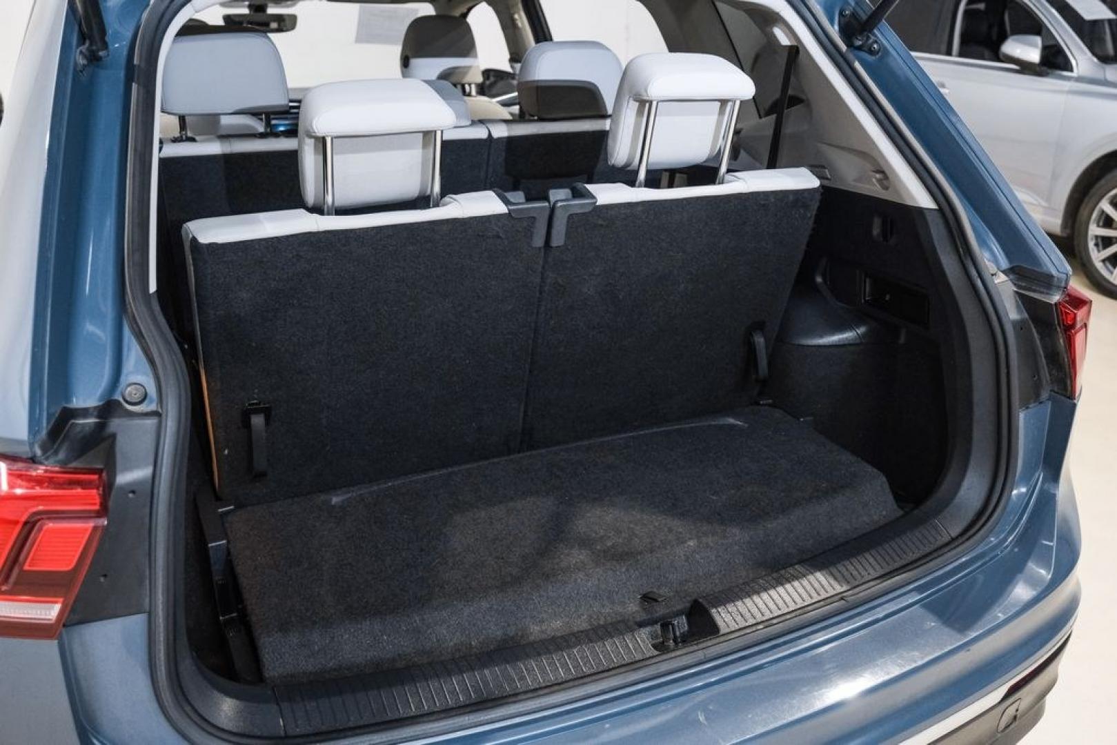 2020 Blue Metallic /Storm Gray Volkswagen Tiguan 2.0T SE (3VV3B7AX0LM) with an 2.0L TSI DOHC engine, Automatic transmission, located at 15300 Midway Rd., Addison, TX, 75001, (972) 702-0011, 32.958321, -96.838074- Photo#51