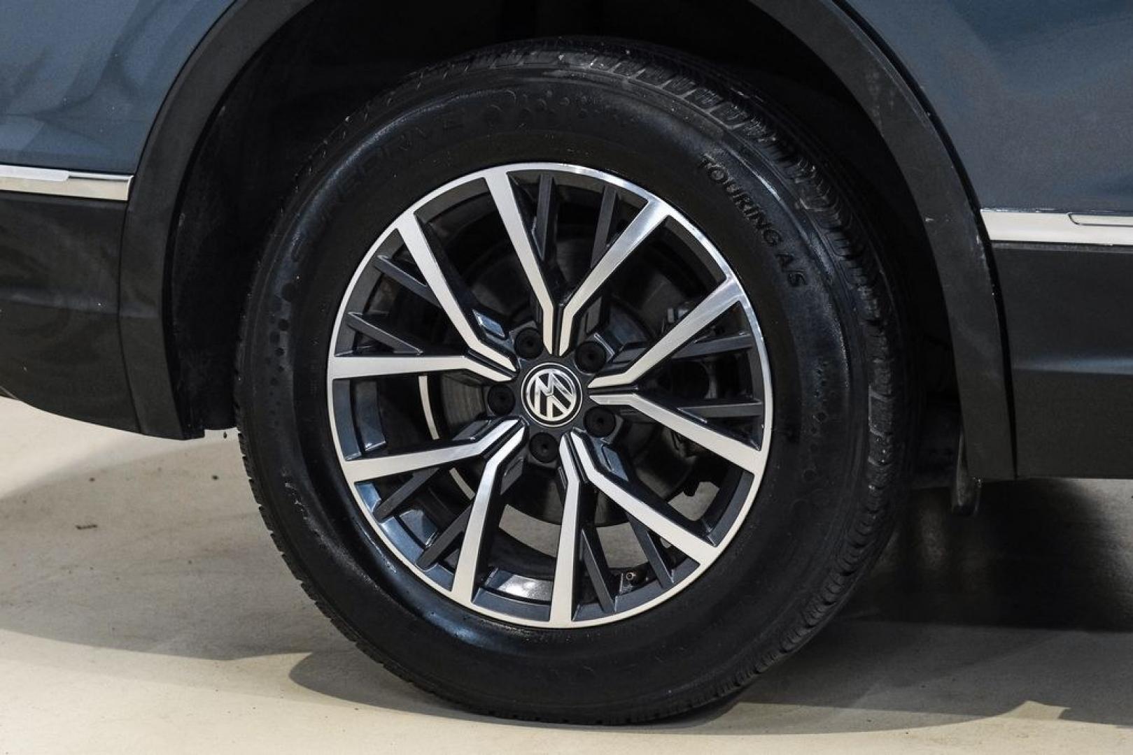 2020 Blue Metallic /Storm Gray Volkswagen Tiguan 2.0T SE (3VV3B7AX0LM) with an 2.0L TSI DOHC engine, Automatic transmission, located at 15300 Midway Rd., Addison, TX, 75001, (972) 702-0011, 32.958321, -96.838074- Photo#54