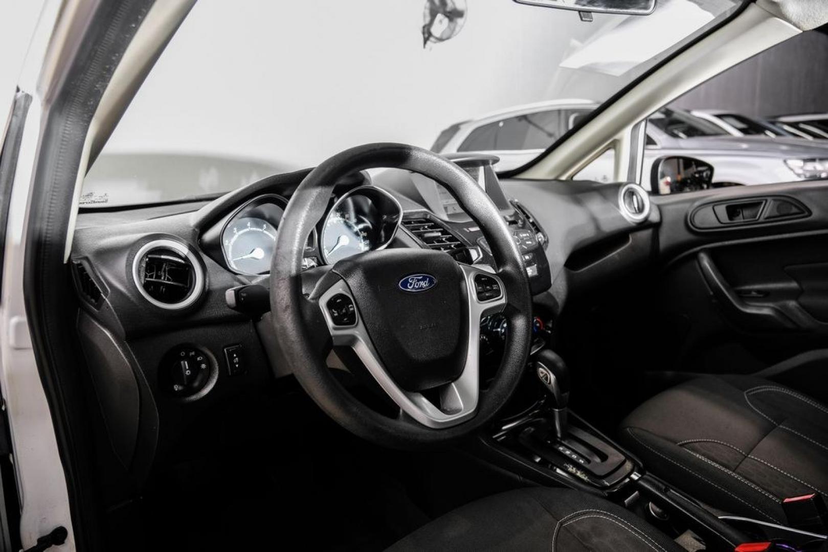 2019 Oxford White /Black Ford Fiesta SE (3FADP4BJ6KM) with an 1.6L I4 Ti-VCT engine, Automatic transmission, located at 15300 Midway Rd., Addison, TX, 75001, (972) 702-0011, 32.958321, -96.838074- Photo#2