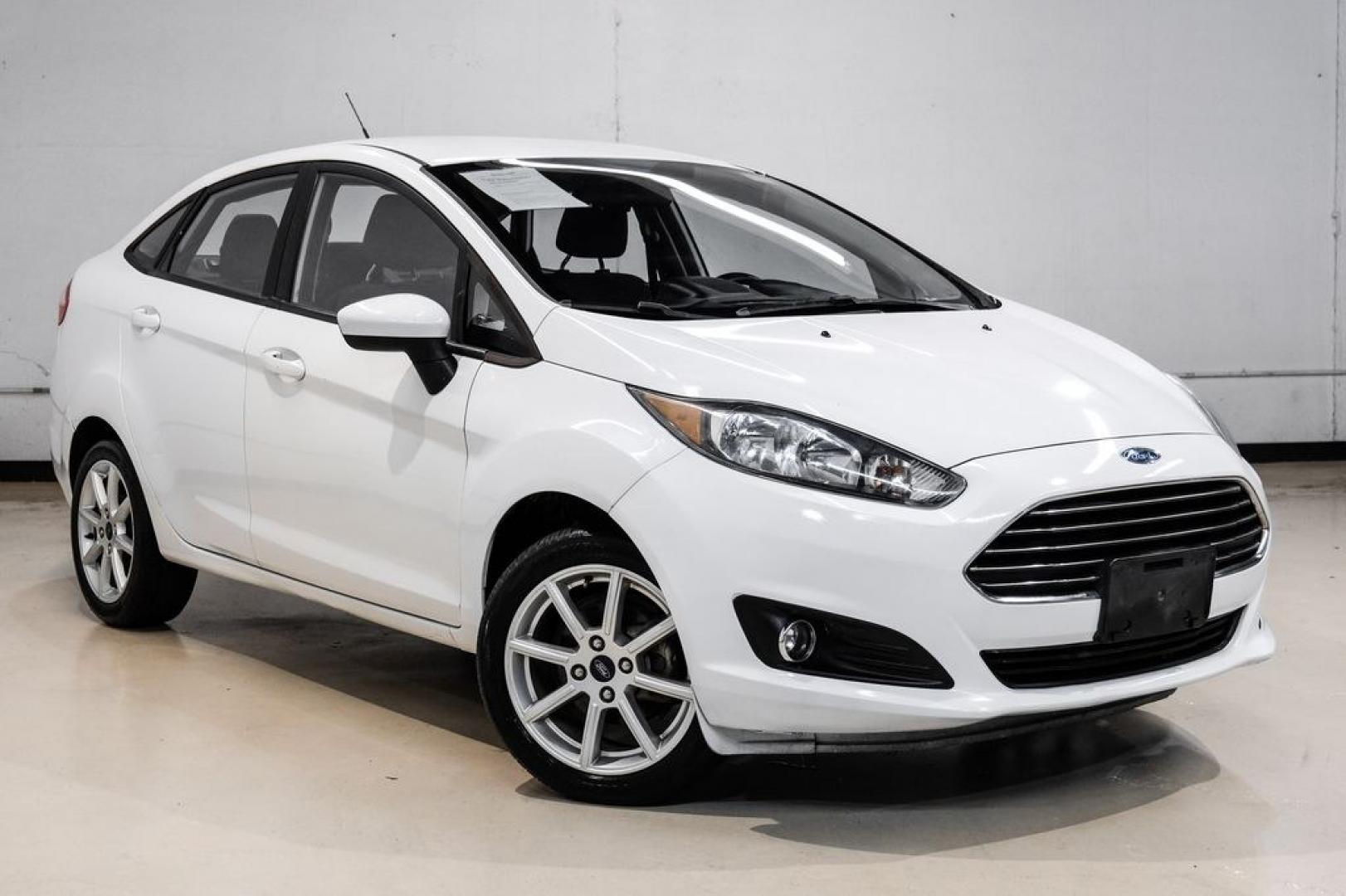 2019 Oxford White /Black Ford Fiesta SE (3FADP4BJ6KM) with an 1.6L I4 Ti-VCT engine, Automatic transmission, located at 15300 Midway Rd., Addison, TX, 75001, (972) 702-0011, 32.958321, -96.838074- Photo#5