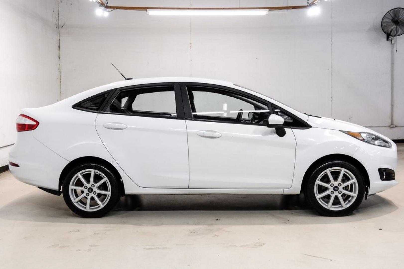 2019 Oxford White /Black Ford Fiesta SE (3FADP4BJ6KM) with an 1.6L I4 Ti-VCT engine, Automatic transmission, located at 15300 Midway Rd., Addison, TX, 75001, (972) 702-0011, 32.958321, -96.838074- Photo#6