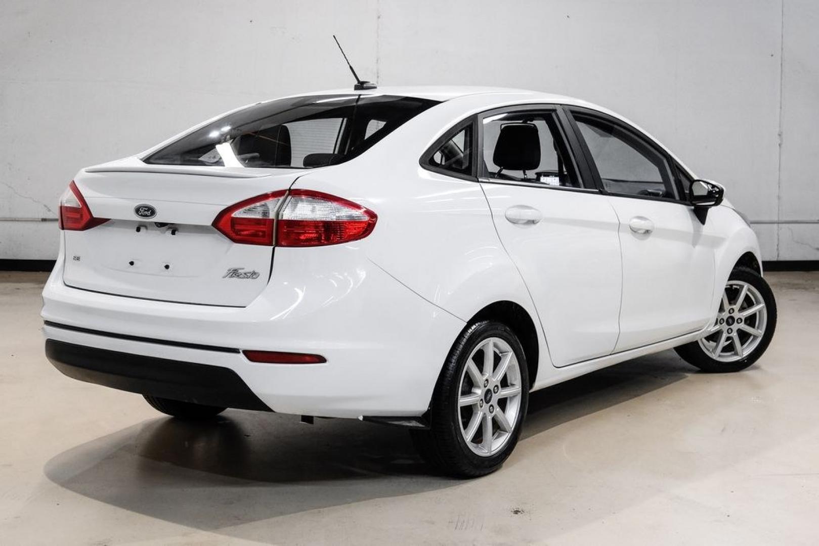 2019 Oxford White /Black Ford Fiesta SE (3FADP4BJ6KM) with an 1.6L I4 Ti-VCT engine, Automatic transmission, located at 15300 Midway Rd., Addison, TX, 75001, (972) 702-0011, 32.958321, -96.838074- Photo#7