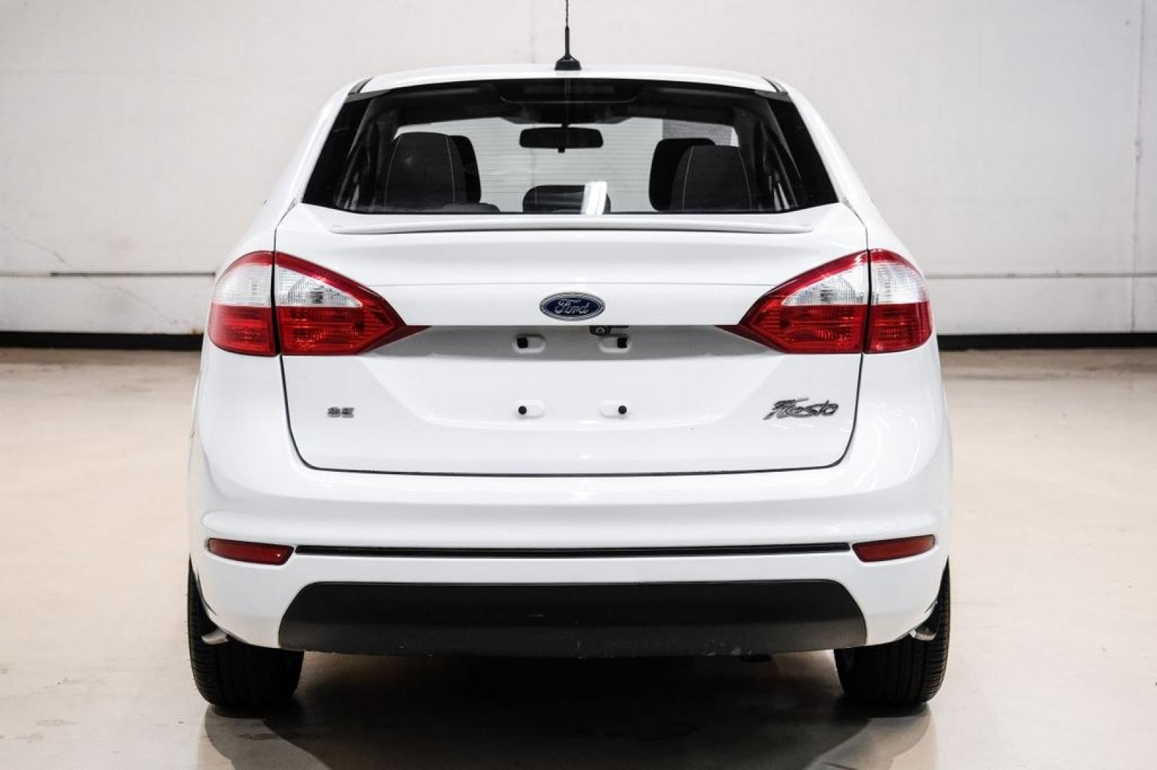 2019 Oxford White /Black Ford Fiesta SE (3FADP4BJ6KM) with an 1.6L I4 Ti-VCT engine, Automatic transmission, located at 15300 Midway Rd., Addison, TX, 75001, (972) 702-0011, 32.958321, -96.838074- Photo#8
