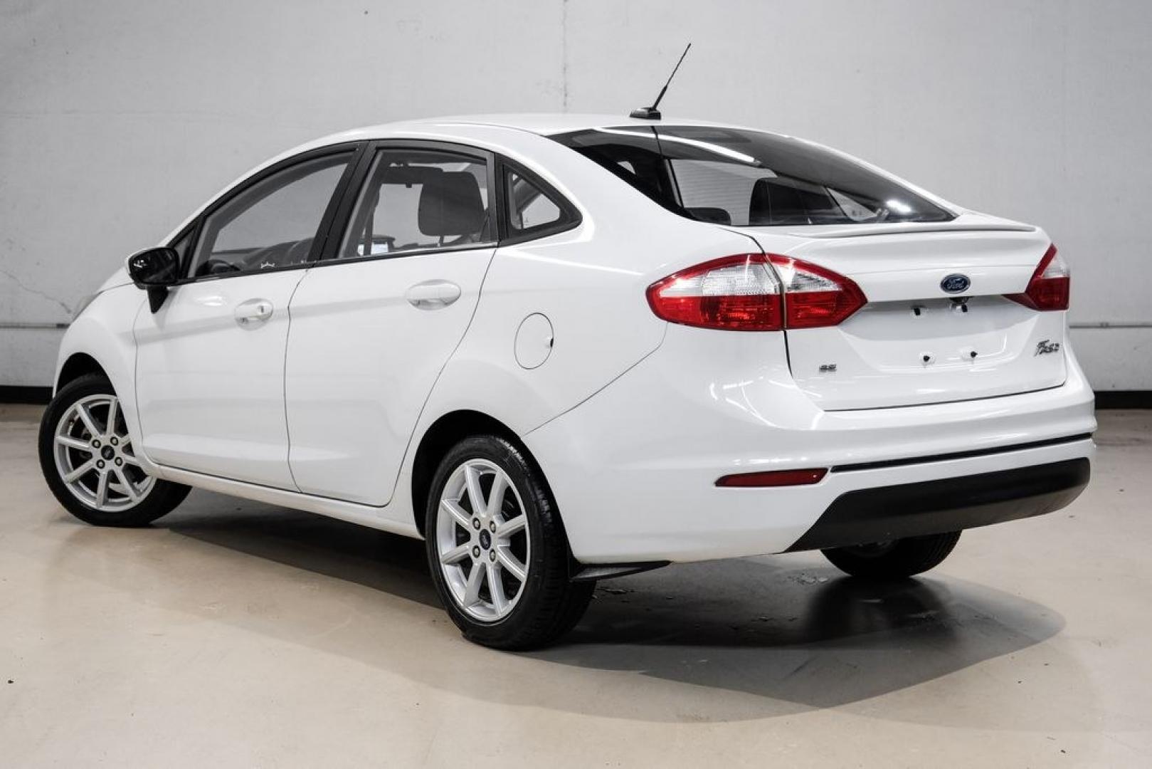 2019 Oxford White /Black Ford Fiesta SE (3FADP4BJ6KM) with an 1.6L I4 Ti-VCT engine, Automatic transmission, located at 15300 Midway Rd., Addison, TX, 75001, (972) 702-0011, 32.958321, -96.838074- Photo#9