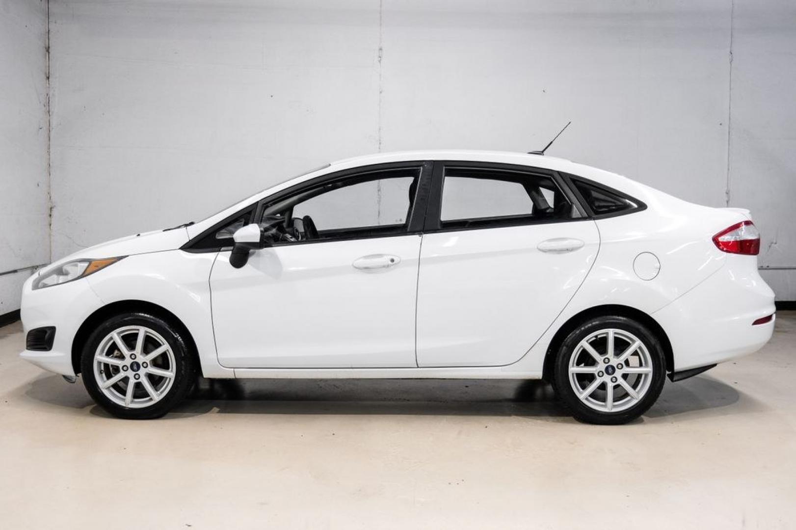 2019 Oxford White /Black Ford Fiesta SE (3FADP4BJ6KM) with an 1.6L I4 Ti-VCT engine, Automatic transmission, located at 15300 Midway Rd., Addison, TX, 75001, (972) 702-0011, 32.958321, -96.838074- Photo#10