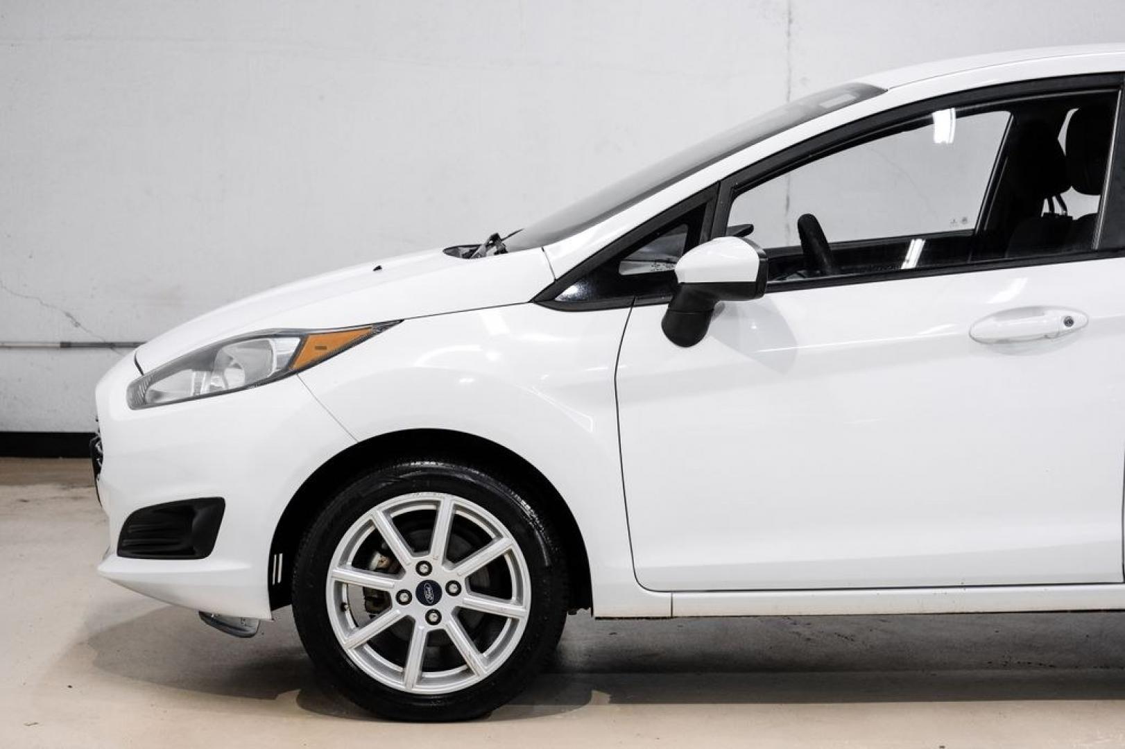 2019 Oxford White /Black Ford Fiesta SE (3FADP4BJ6KM) with an 1.6L I4 Ti-VCT engine, Automatic transmission, located at 15300 Midway Rd., Addison, TX, 75001, (972) 702-0011, 32.958321, -96.838074- Photo#11