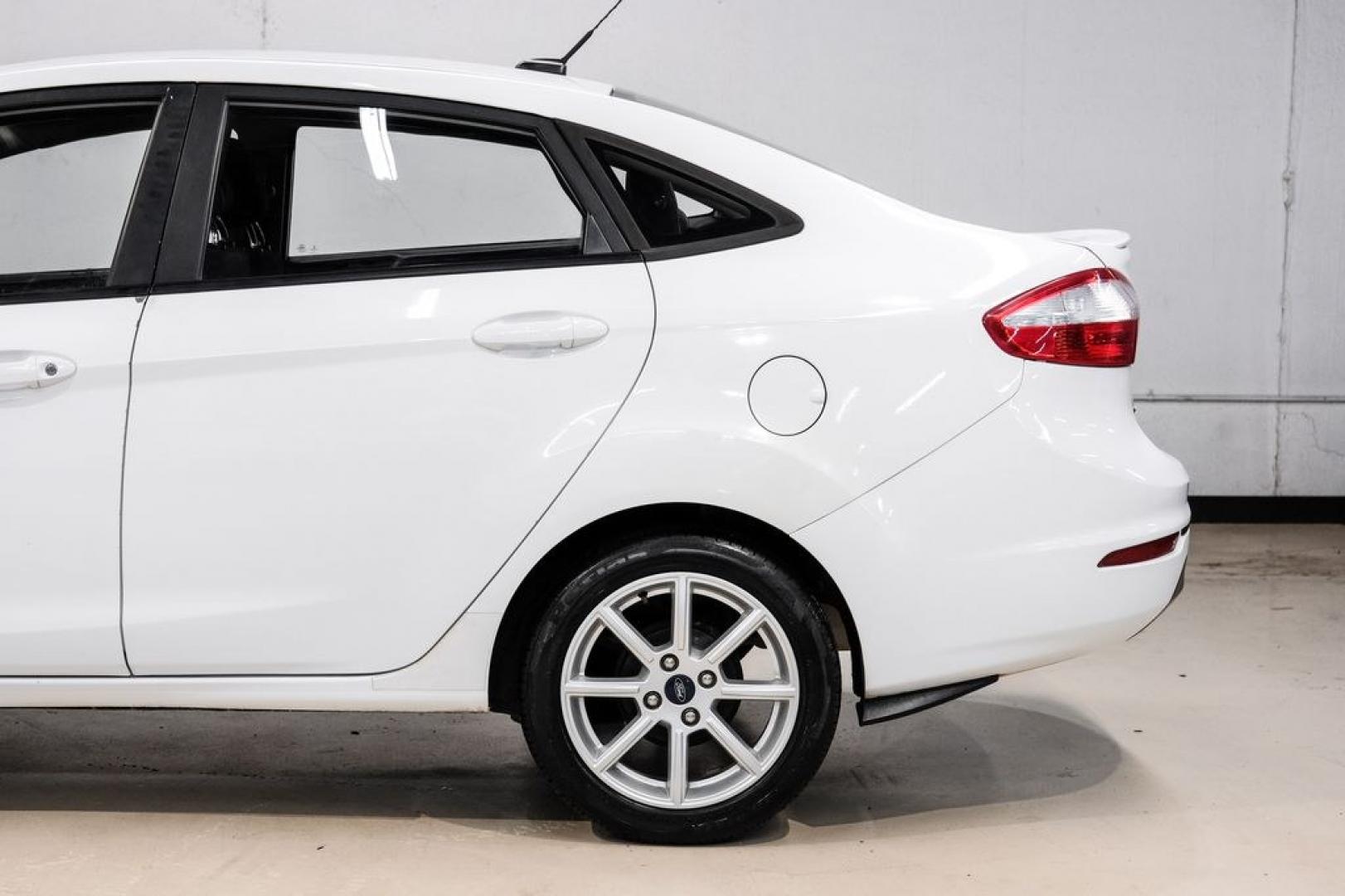 2019 Oxford White /Black Ford Fiesta SE (3FADP4BJ6KM) with an 1.6L I4 Ti-VCT engine, Automatic transmission, located at 15300 Midway Rd., Addison, TX, 75001, (972) 702-0011, 32.958321, -96.838074- Photo#12